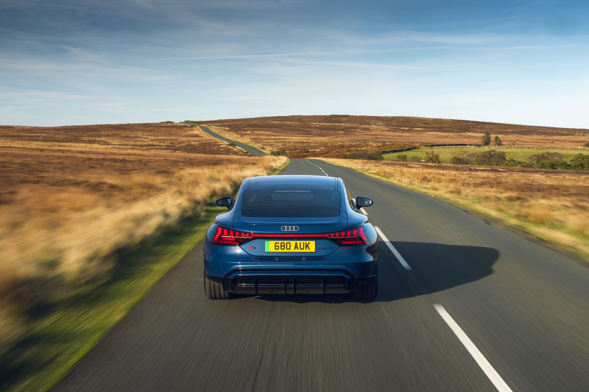 2026 audi s e tron gt quattro driving rear open road blue