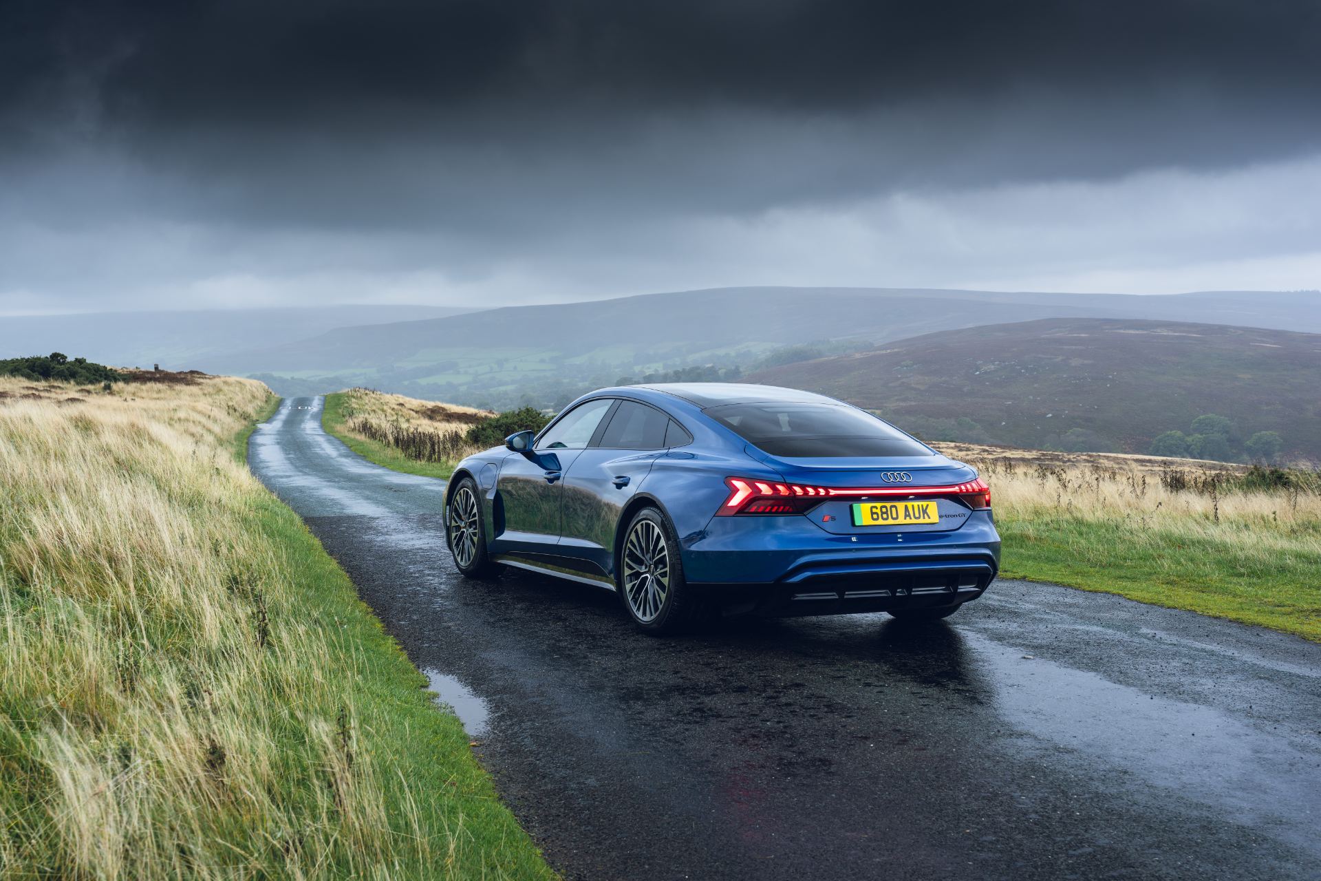 2026 audi s e tron gt quattro rear three quarter wet road blue