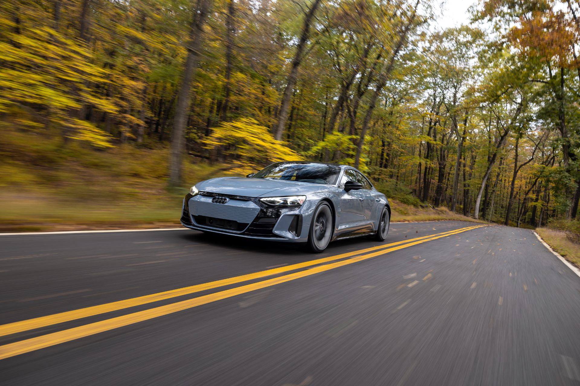2026 audi s e tron gt driving front three quarter autumn road grey