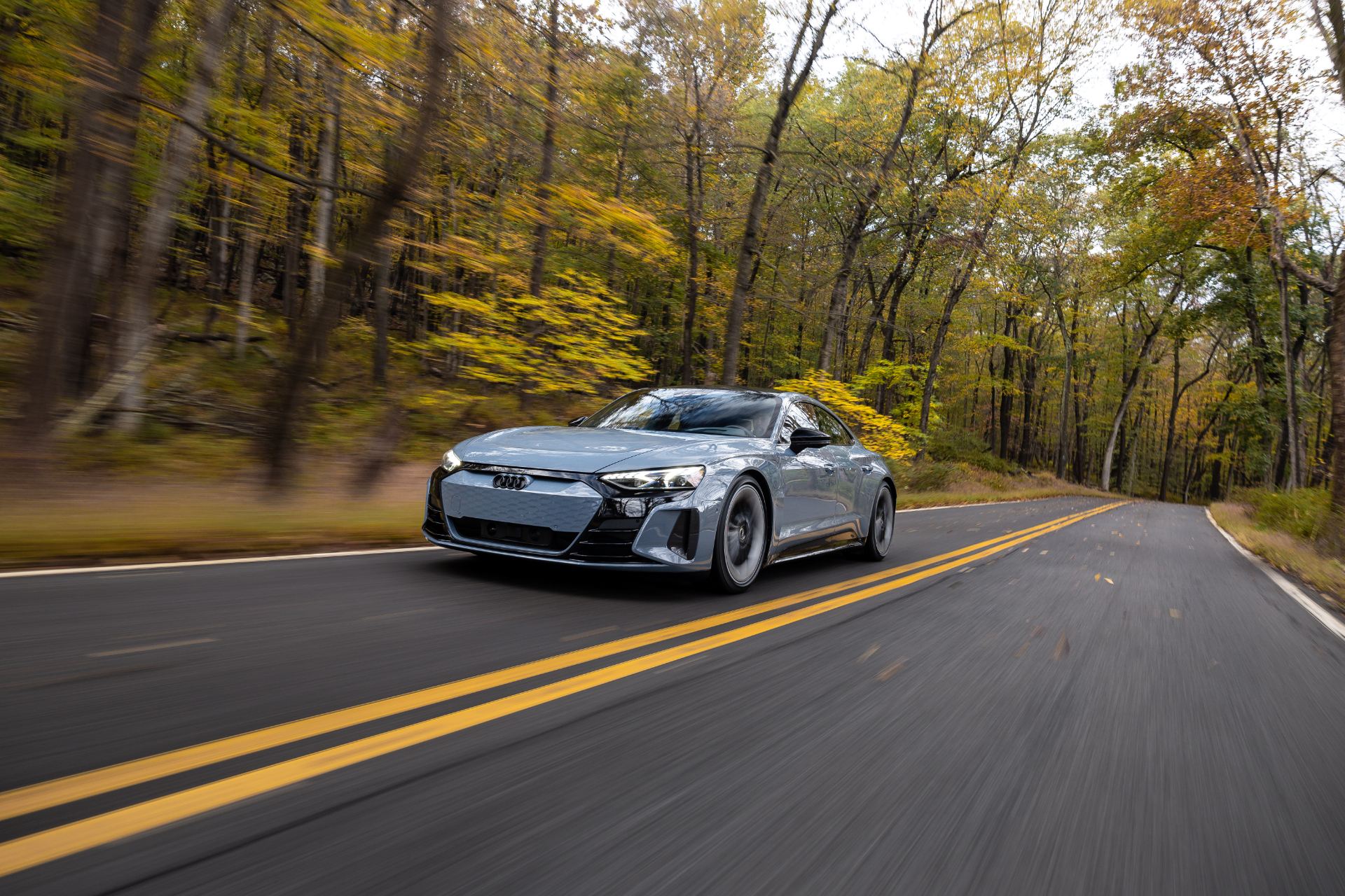 2026 audi s e tron gt driving front distant autumn road grey