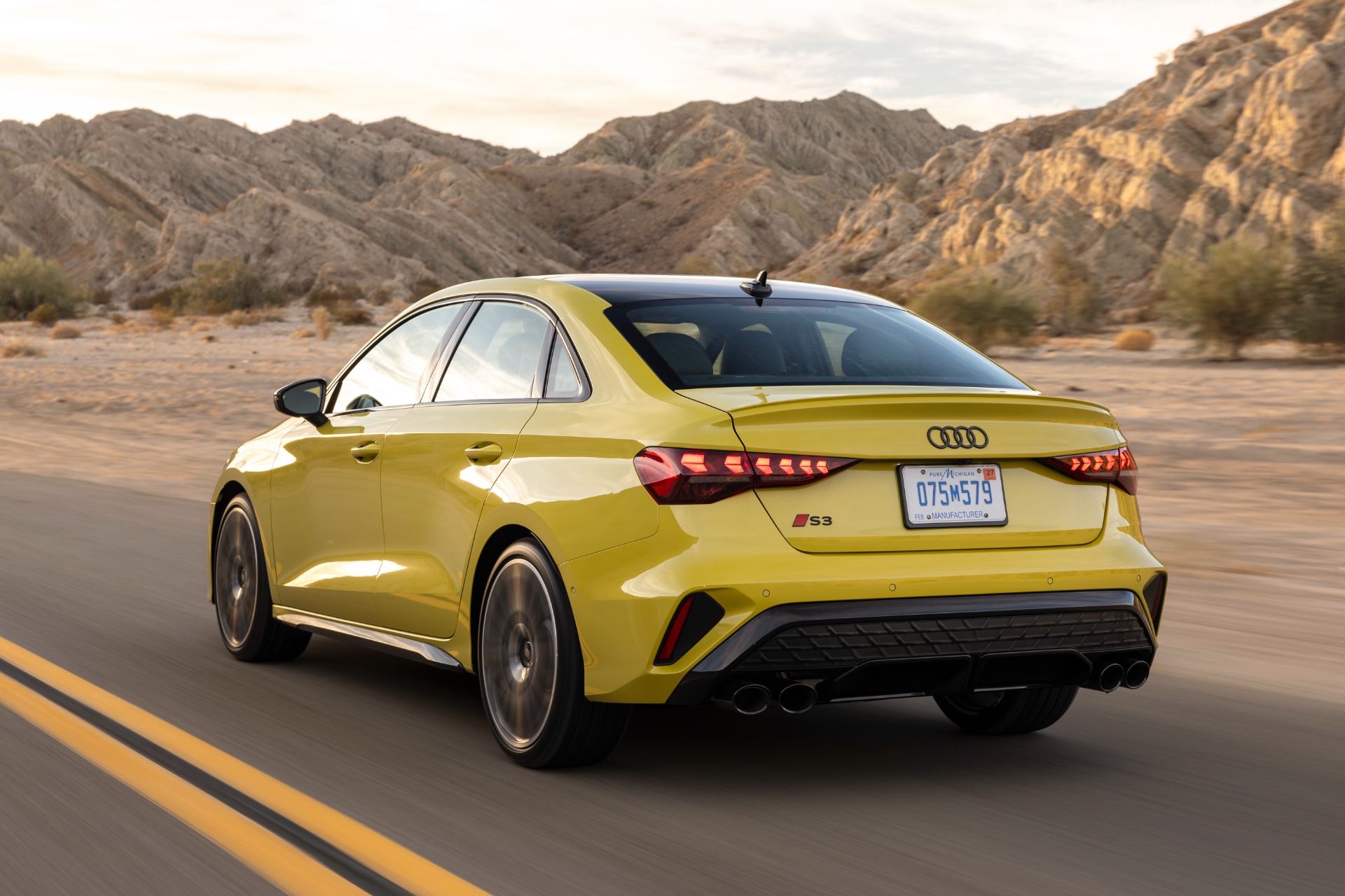 2026 audi s3 driving rear three quarter desert yellow