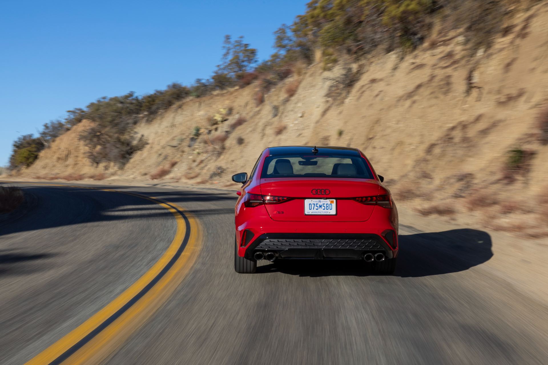 2026 audi s3 driving rear winding road red