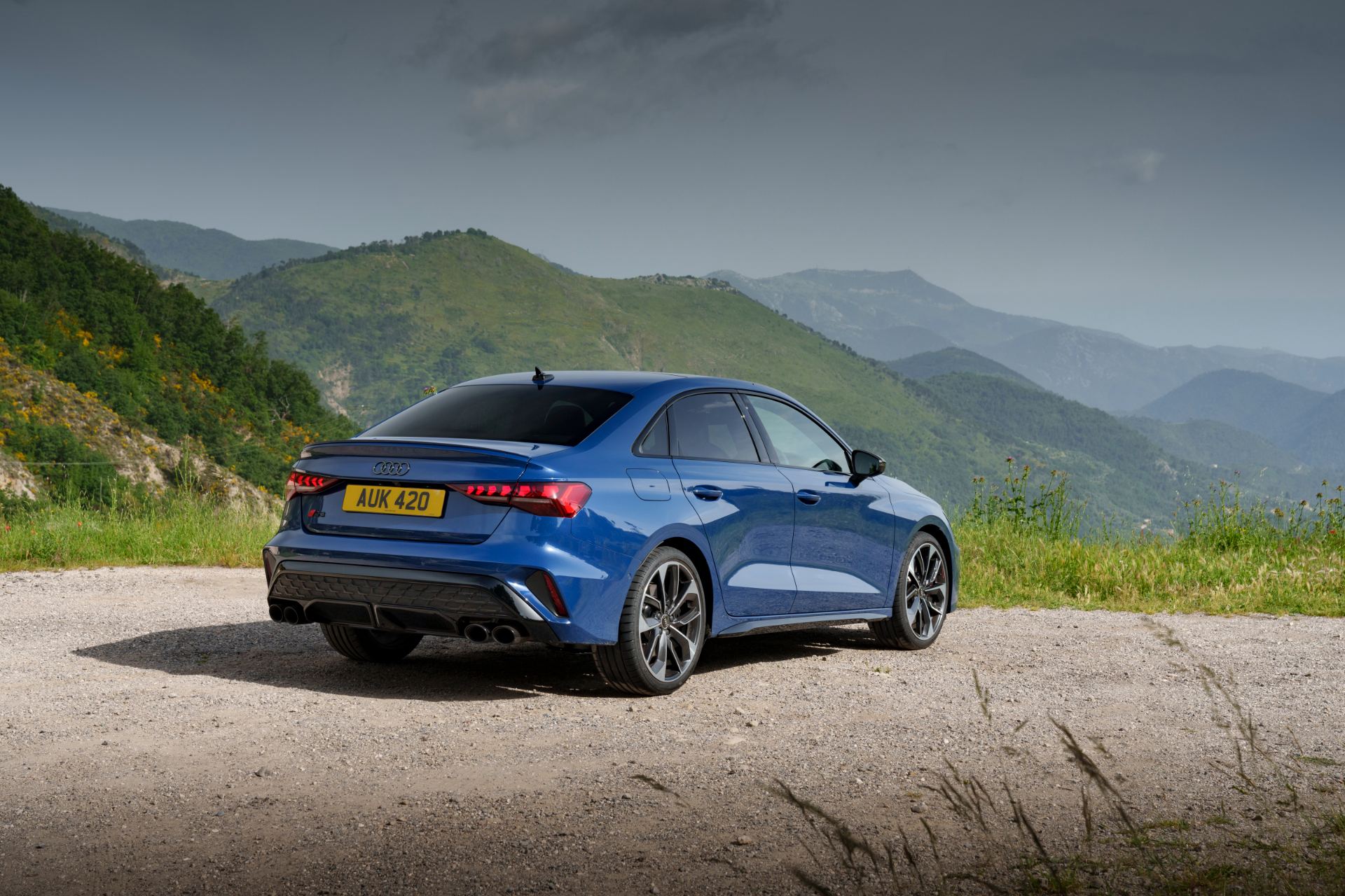 2025 audi s3 saloon rear three quarter mountains blue