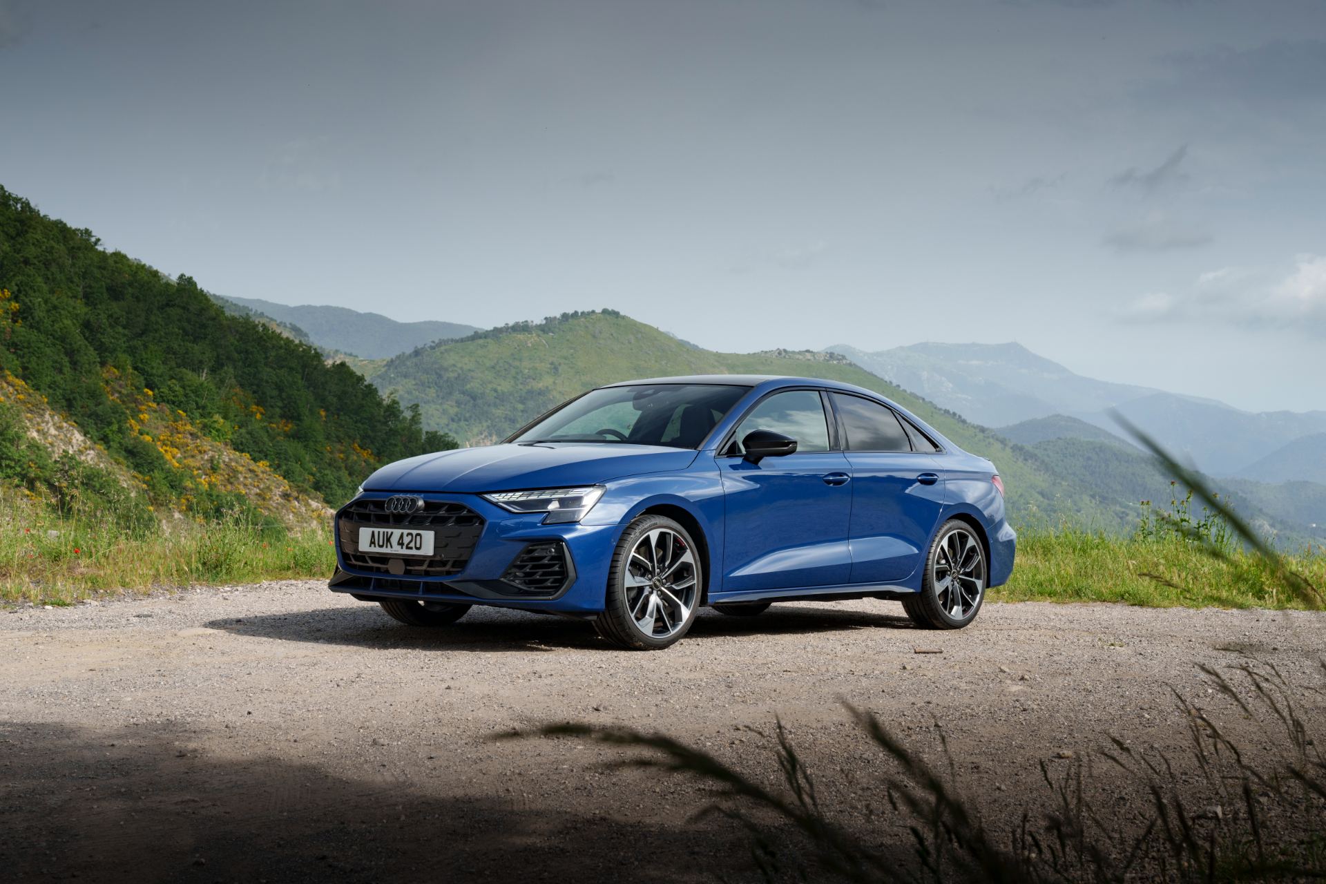 2025 audi s3 saloon front three quarter mountains blue