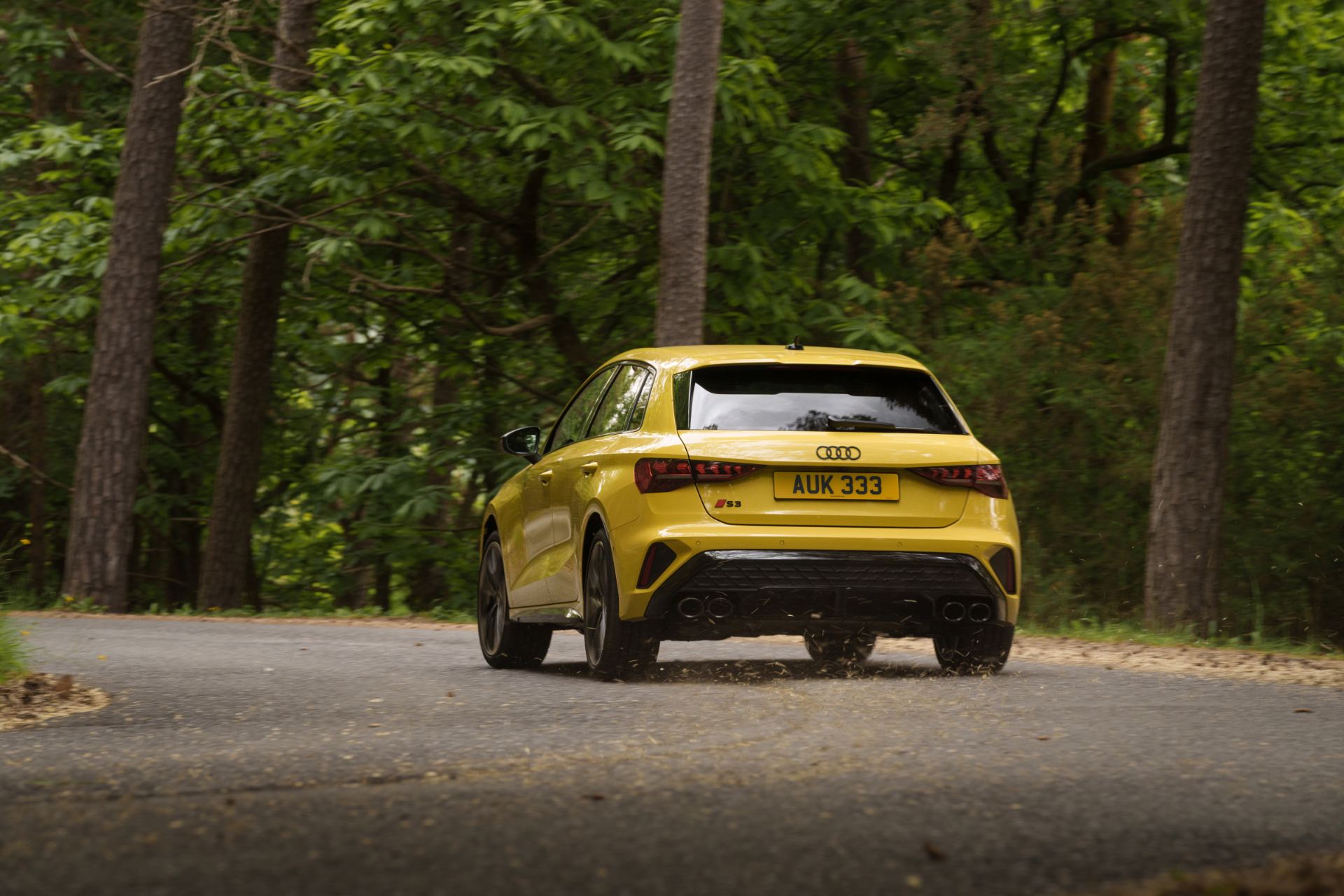 2025 audi s3 sportback driving rear forest yellow
