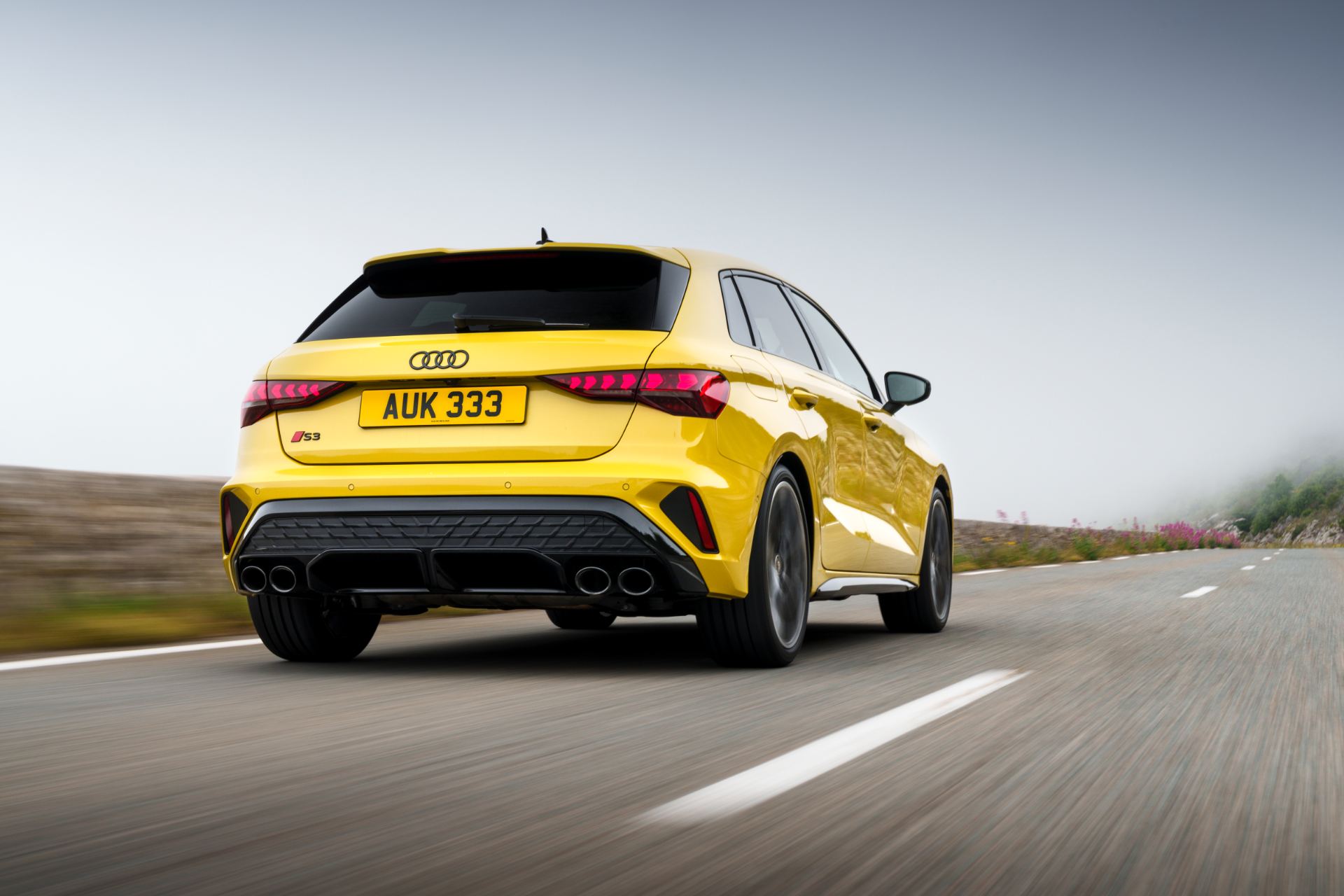 2025 audi s3 sportback driving rear yellow