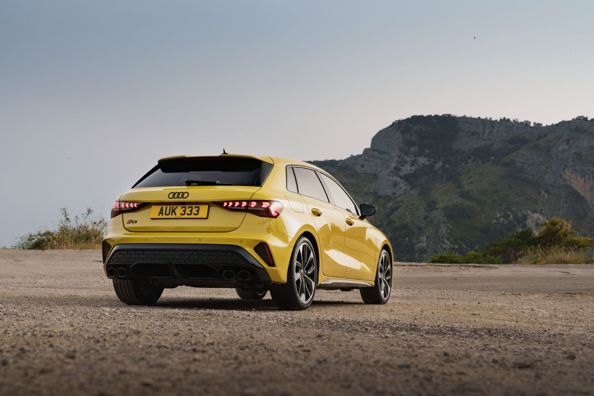 2025 audi s3 sportback rear three quarter mountain yellow