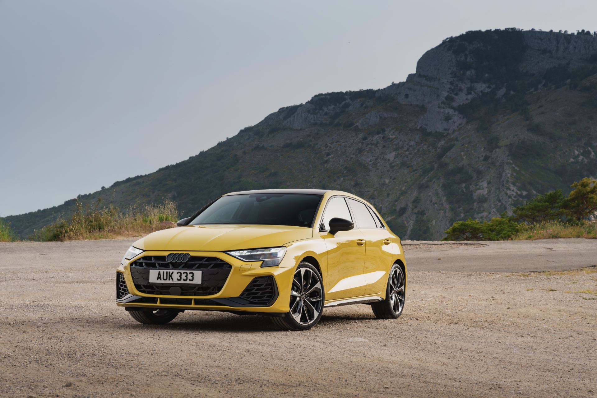 2025 audi s3 sportback front three quarter mountain yellow