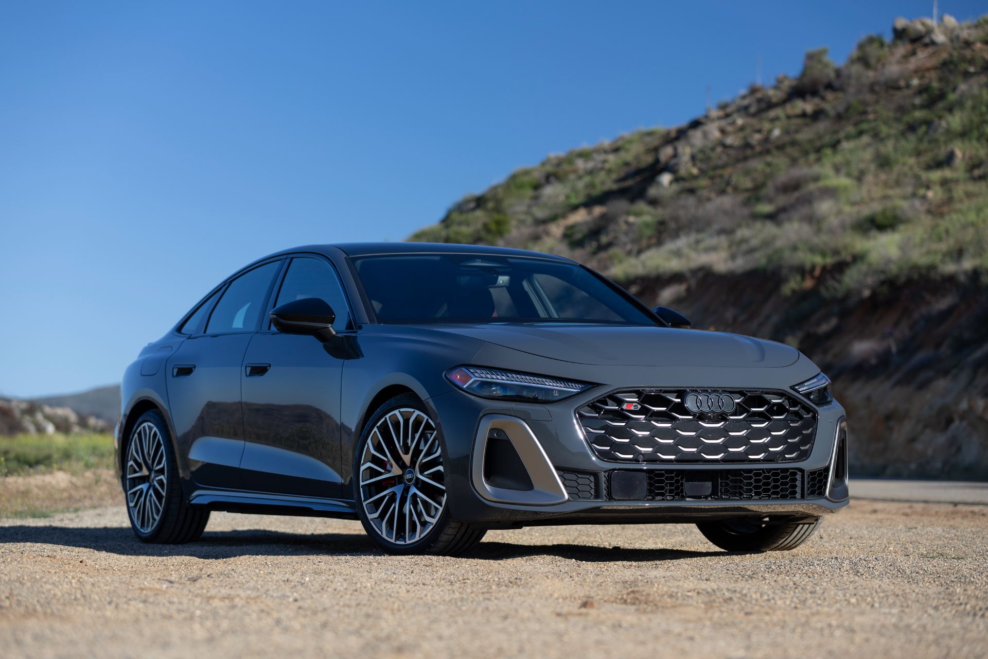 2026 audi s5 front three quarter hillside grey