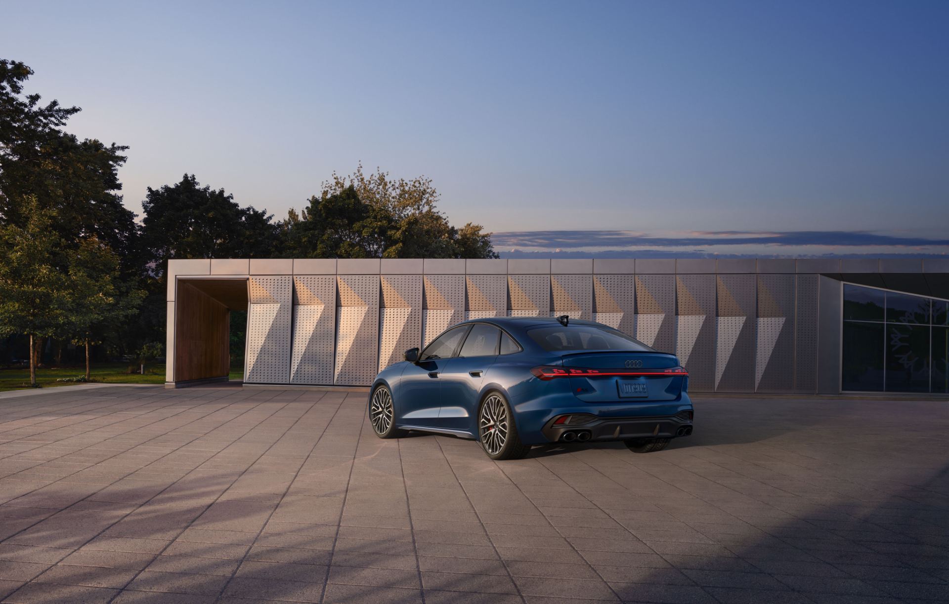 2026 audi s5 rear three quarter building dusk blue