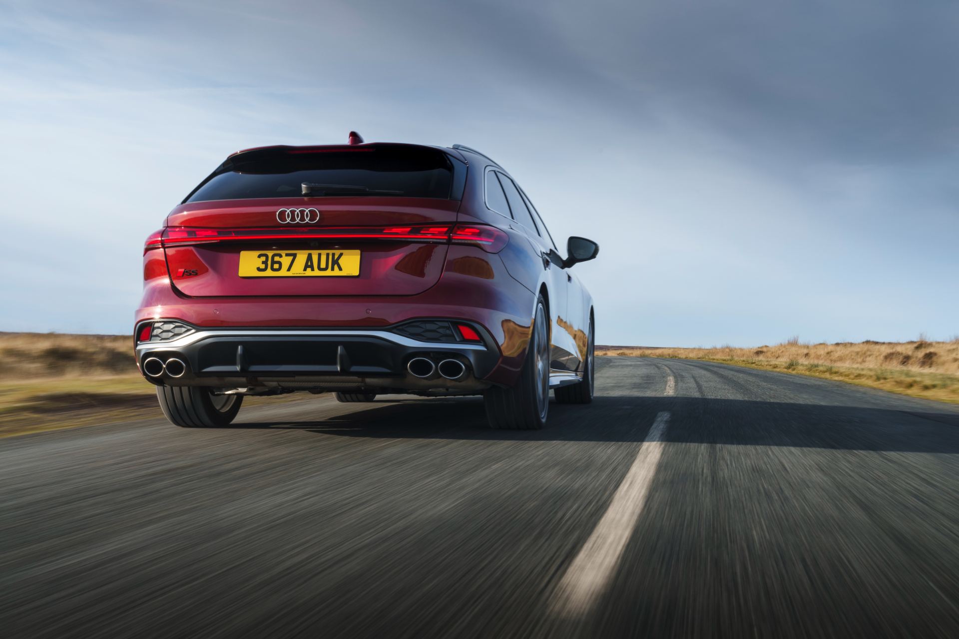 2026 audi s5 avant driving rear low angle red