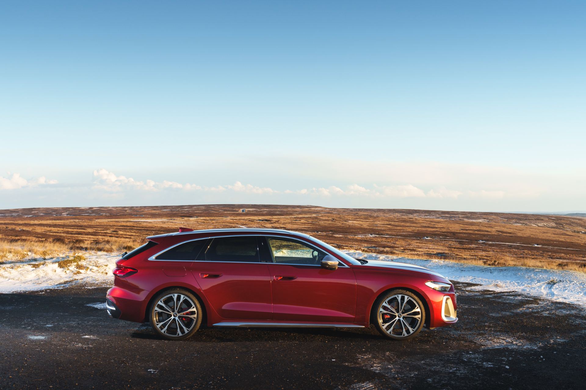 2026 audi s5 avant side profile snowy moorland red