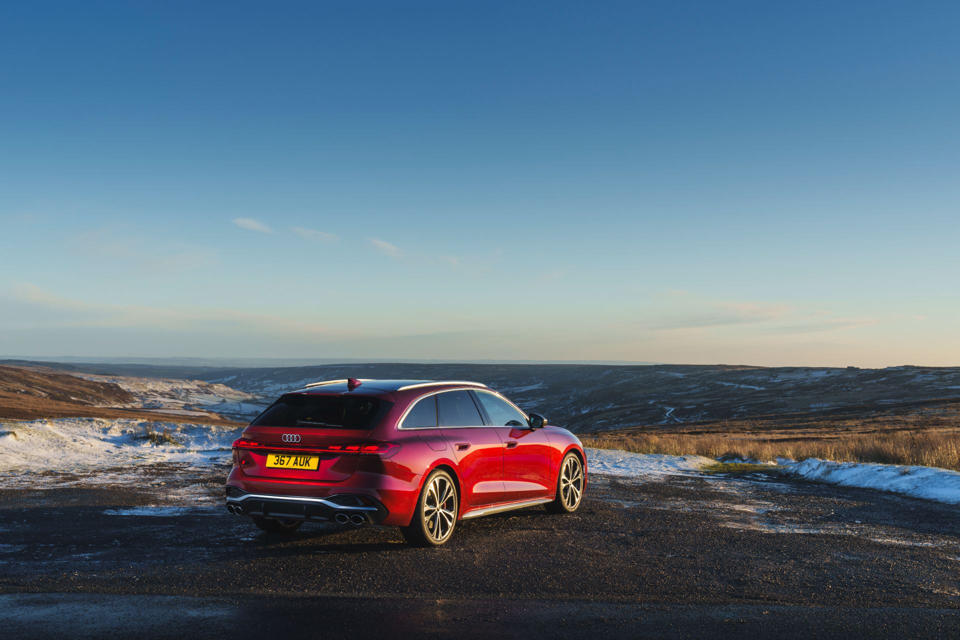 2026 audi s5 avant rear three quarter snowy moorland red