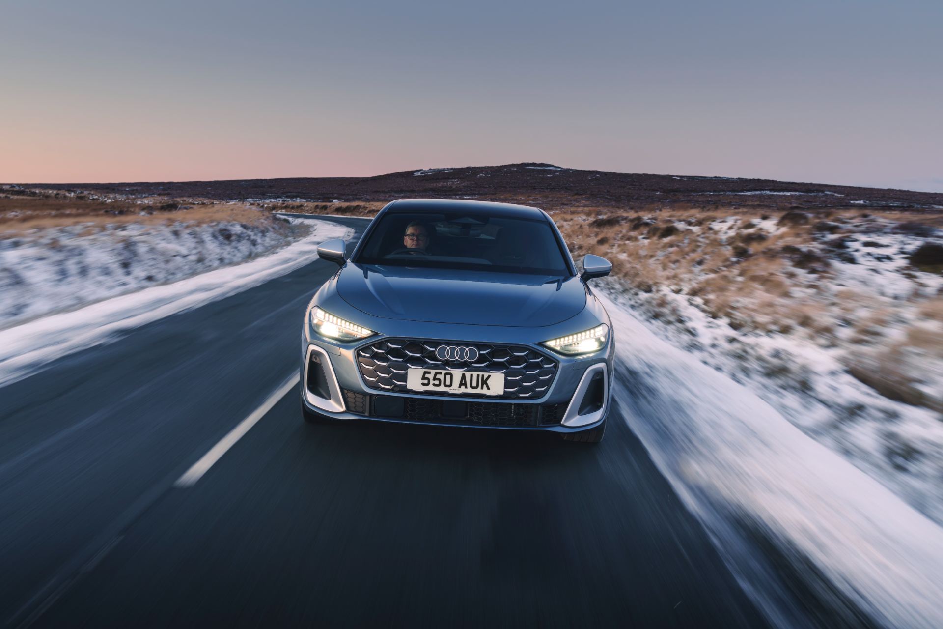 2026 audi s5 saloon driving front snowy road grey