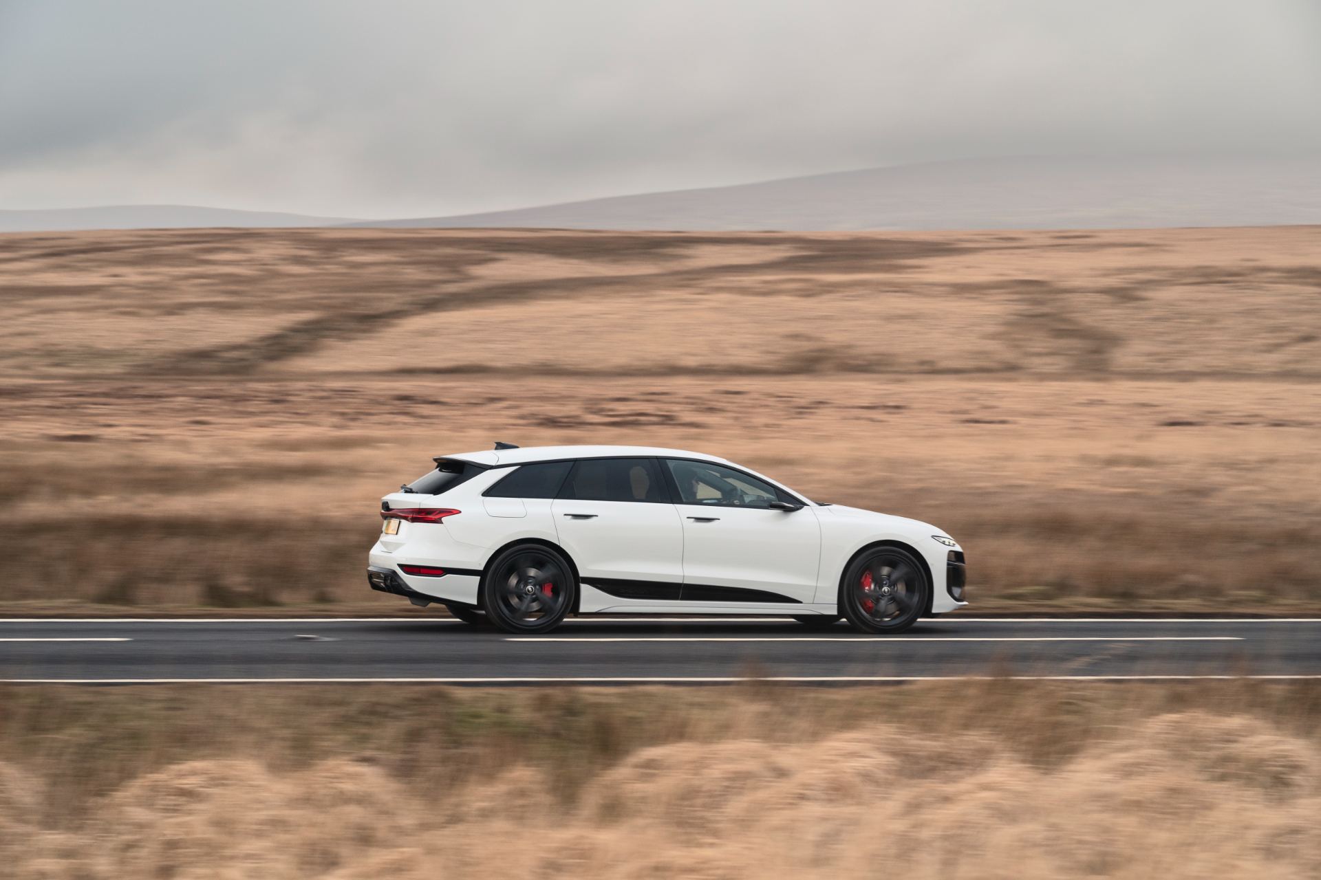 2026 audi s6 avant e tron driving side profile moorland white