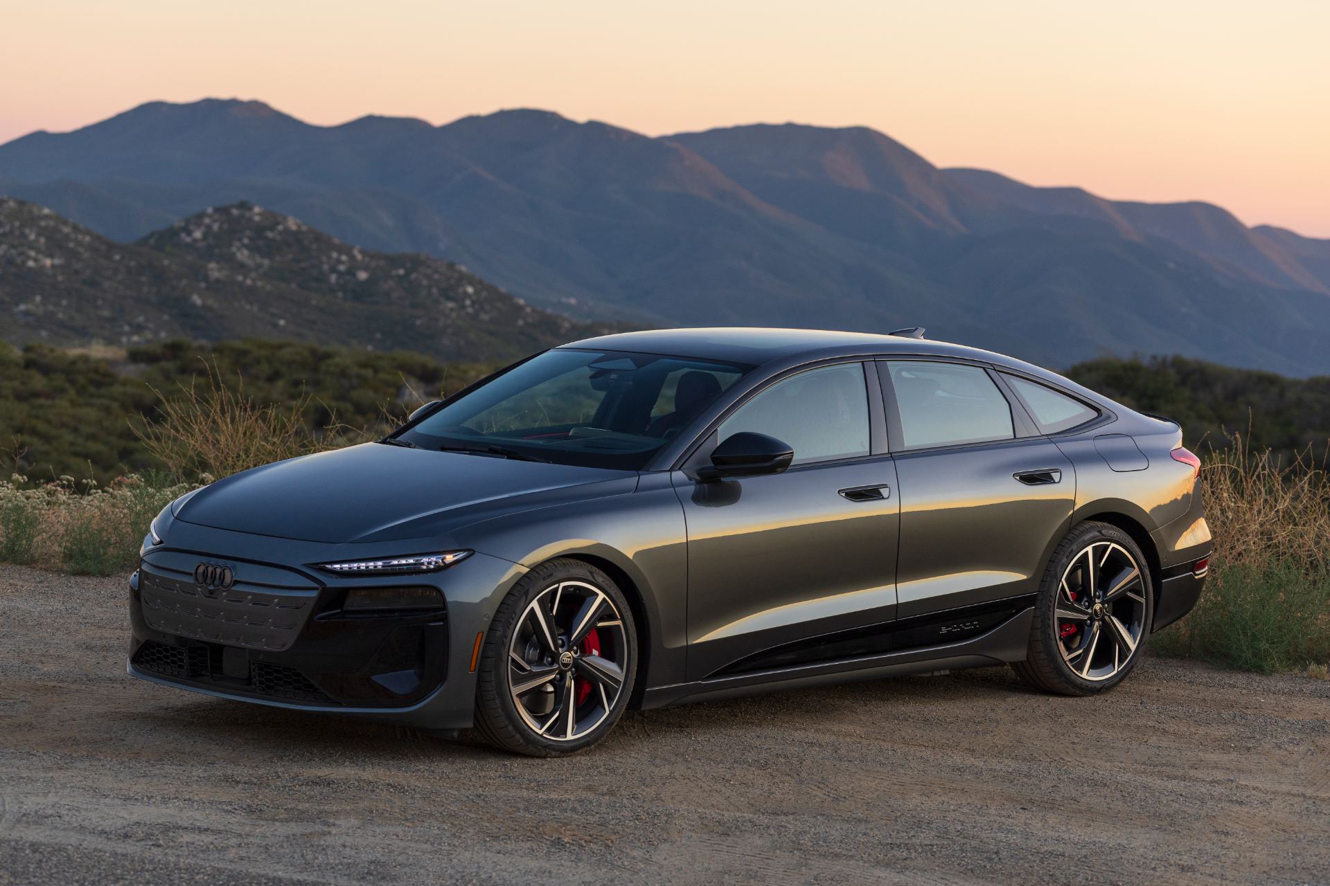 2027 audi s6 sportback e tron front three quarter mountains grey