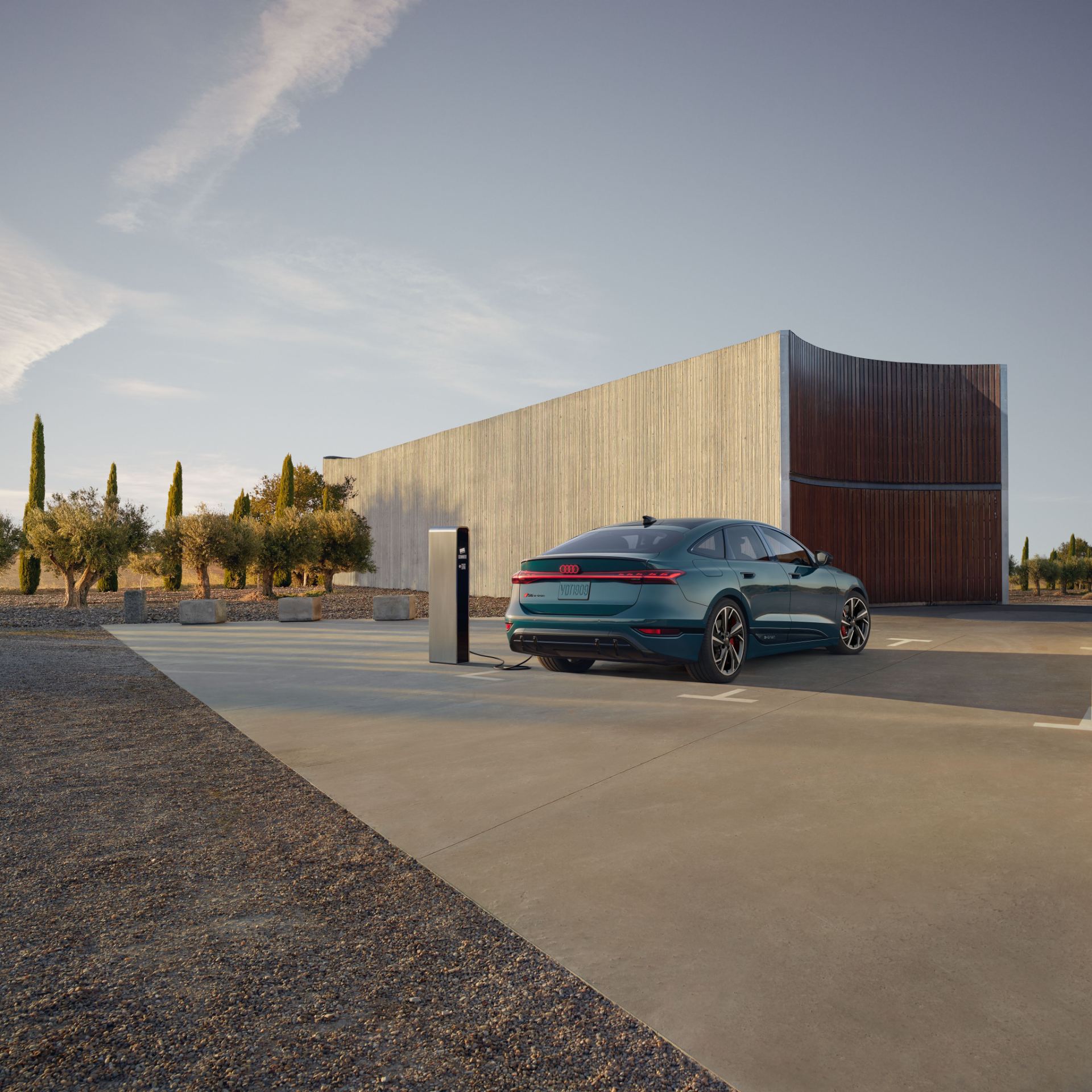 2027 audi s6 sportback e tron rear three quarter charging station teal