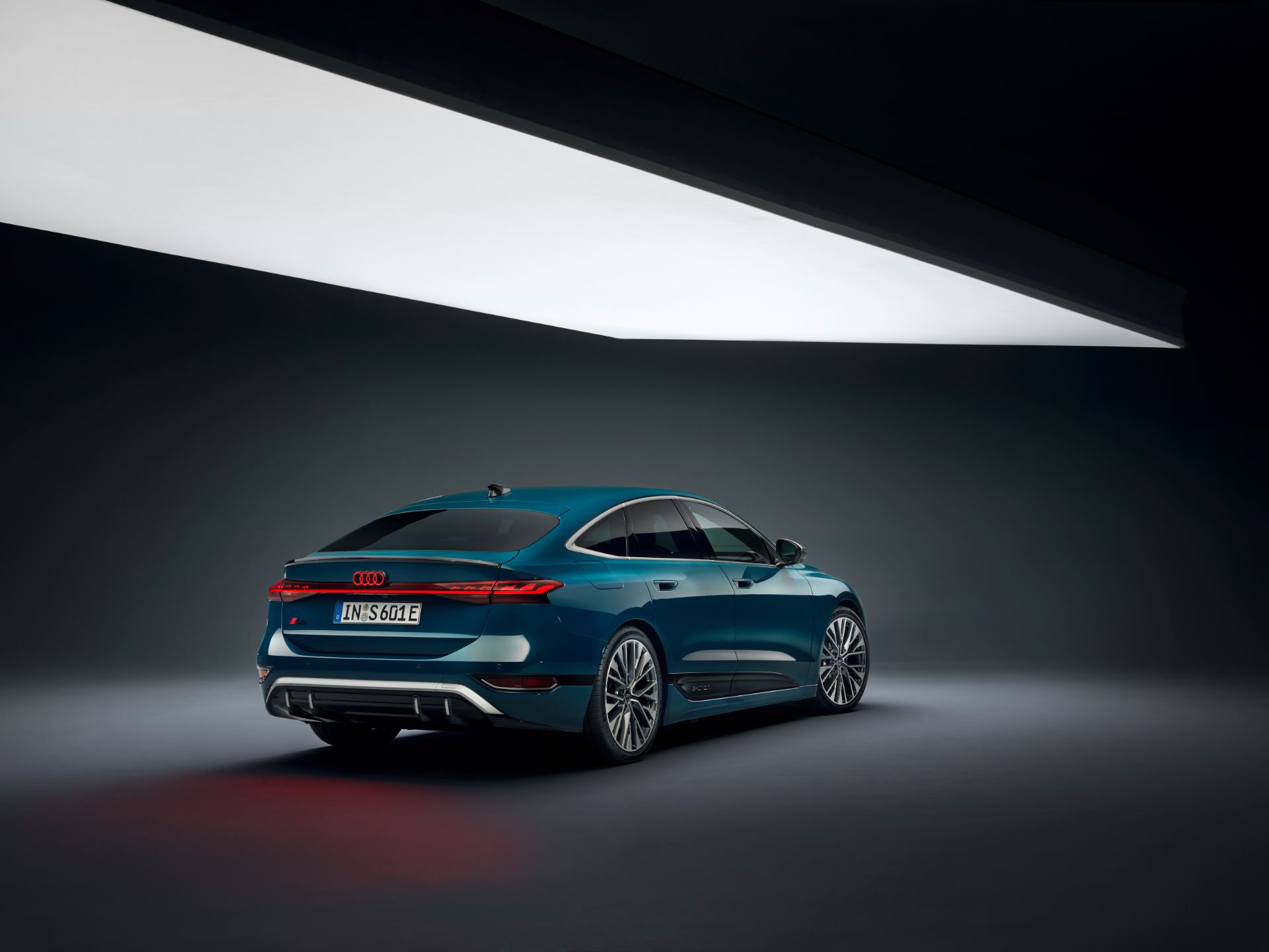 2026 audi s6 sportback e tron rear three quarter studio teal