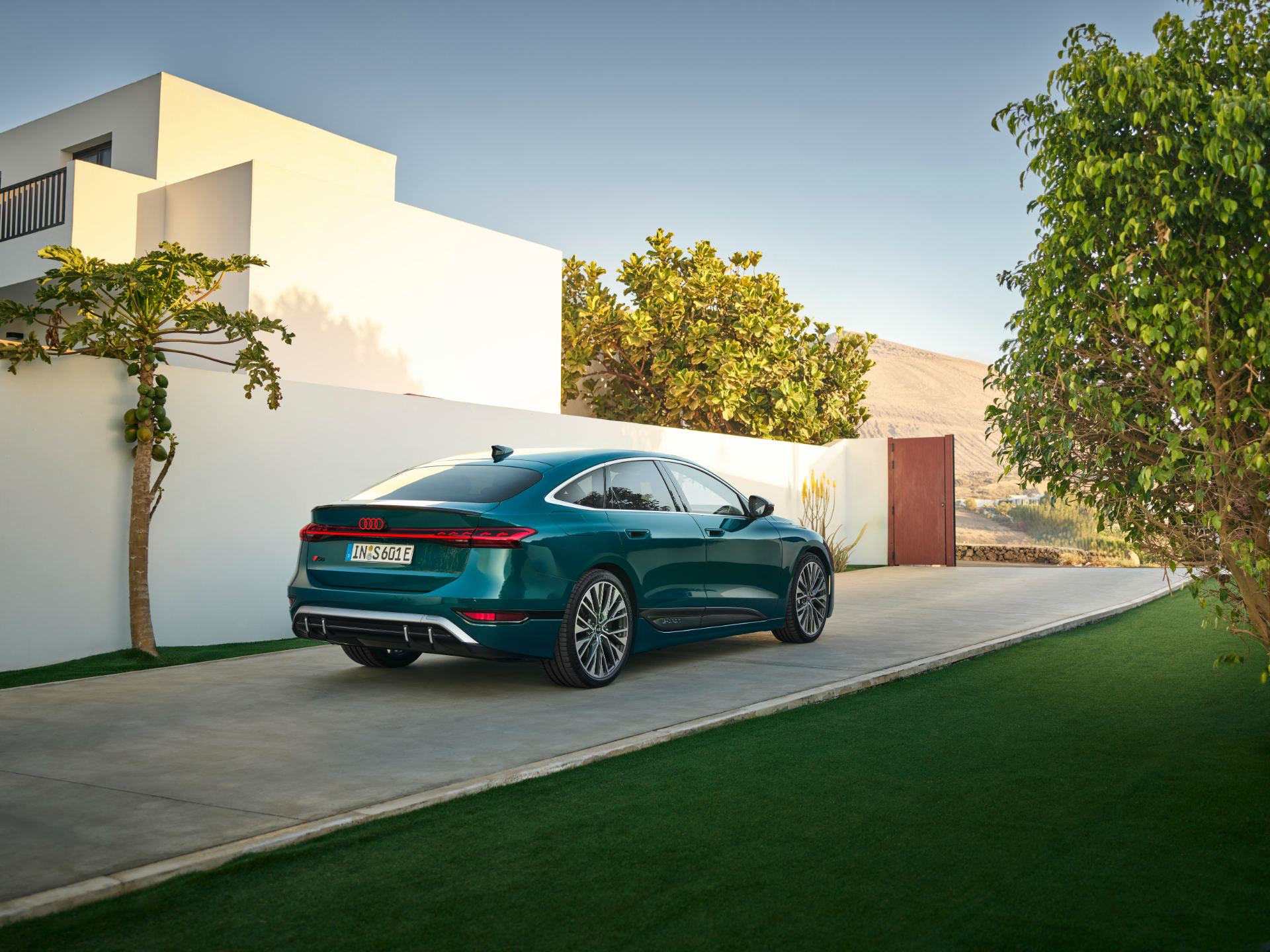 2026 audi s6 sportback e tron rear three quarter courtyard teal