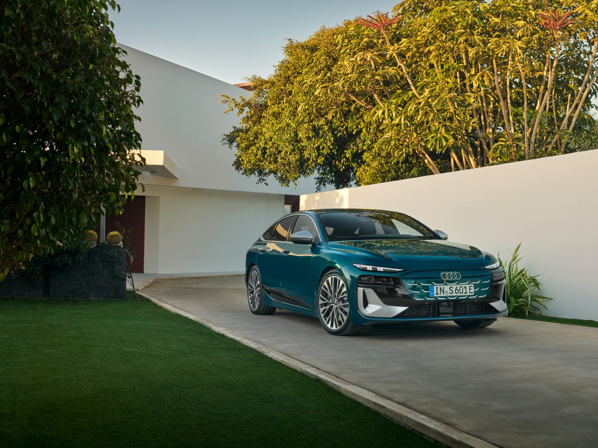 2026 audi s6 sportback e tron front three quarter courtyard teal
