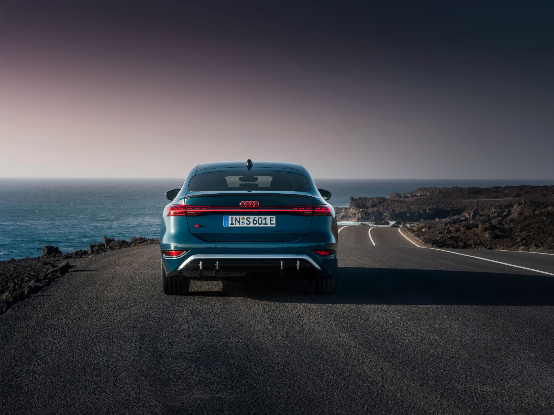 2026 audi s6 sportback e tron rear coastal road dusk teal