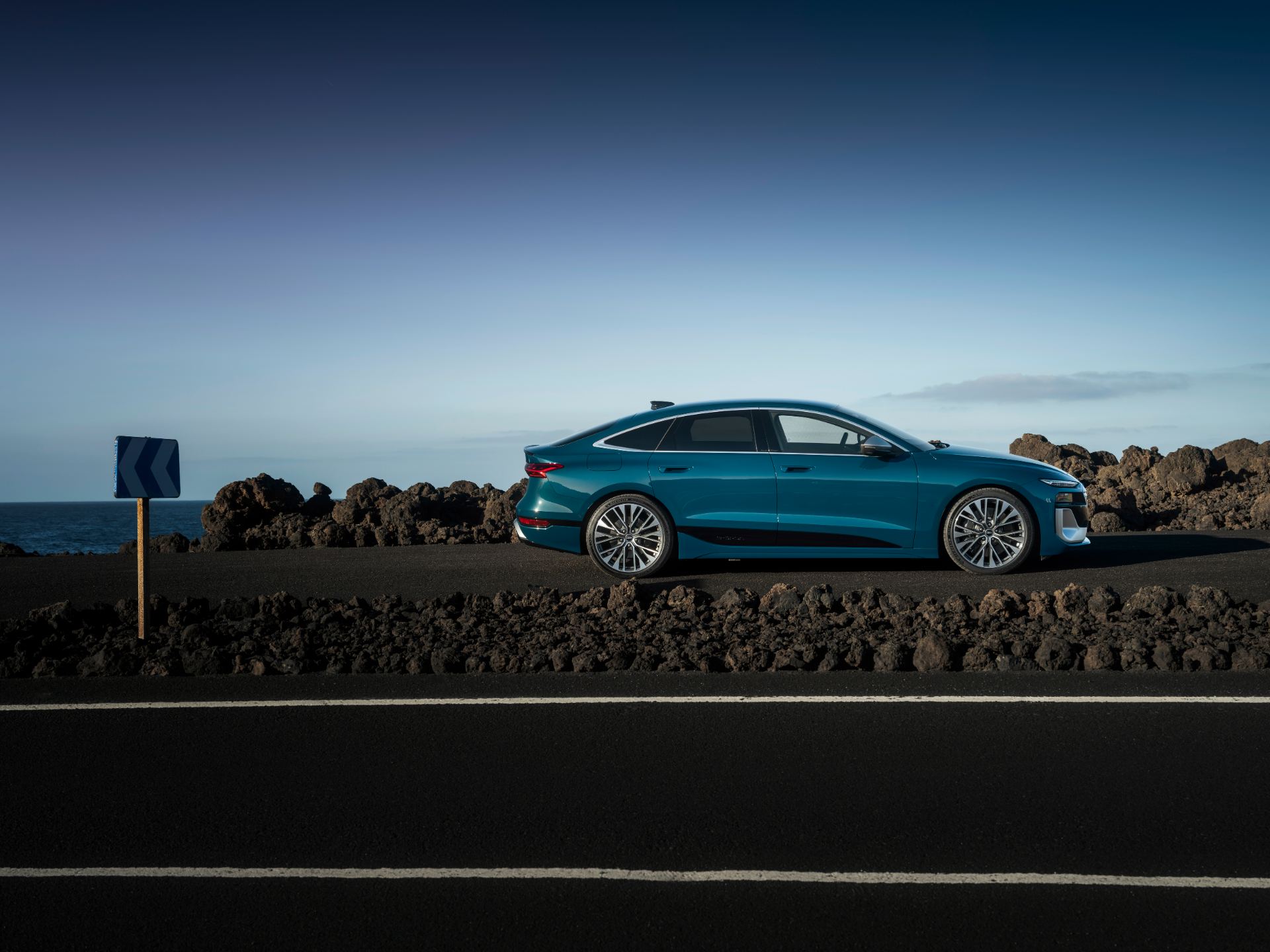 2026 audi s6 sportback e tron side profile coastal road teal