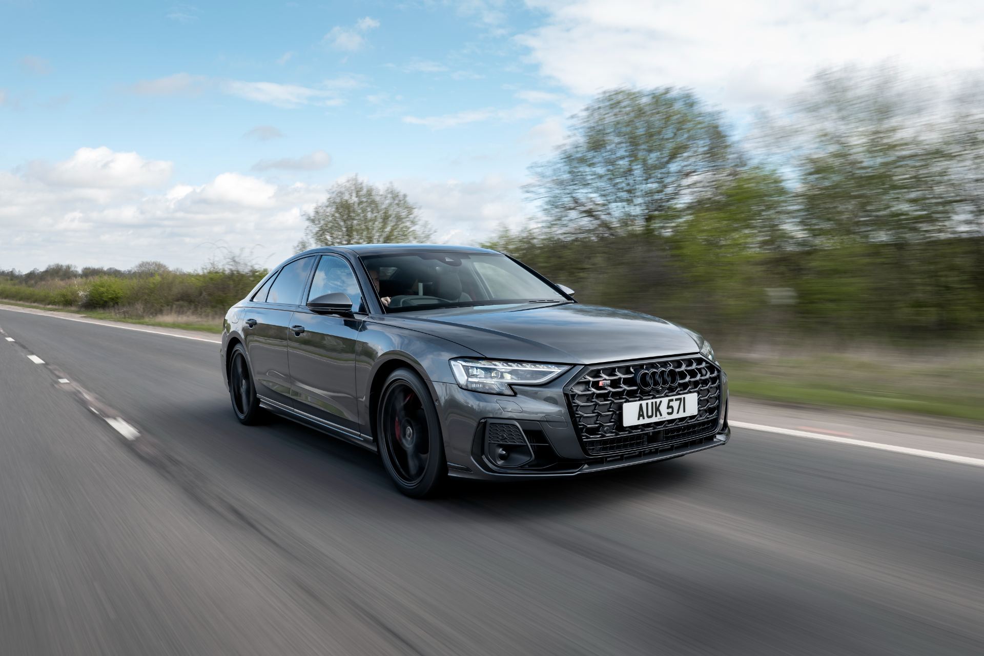 2025 audi s8 driving front three quarter highway grey