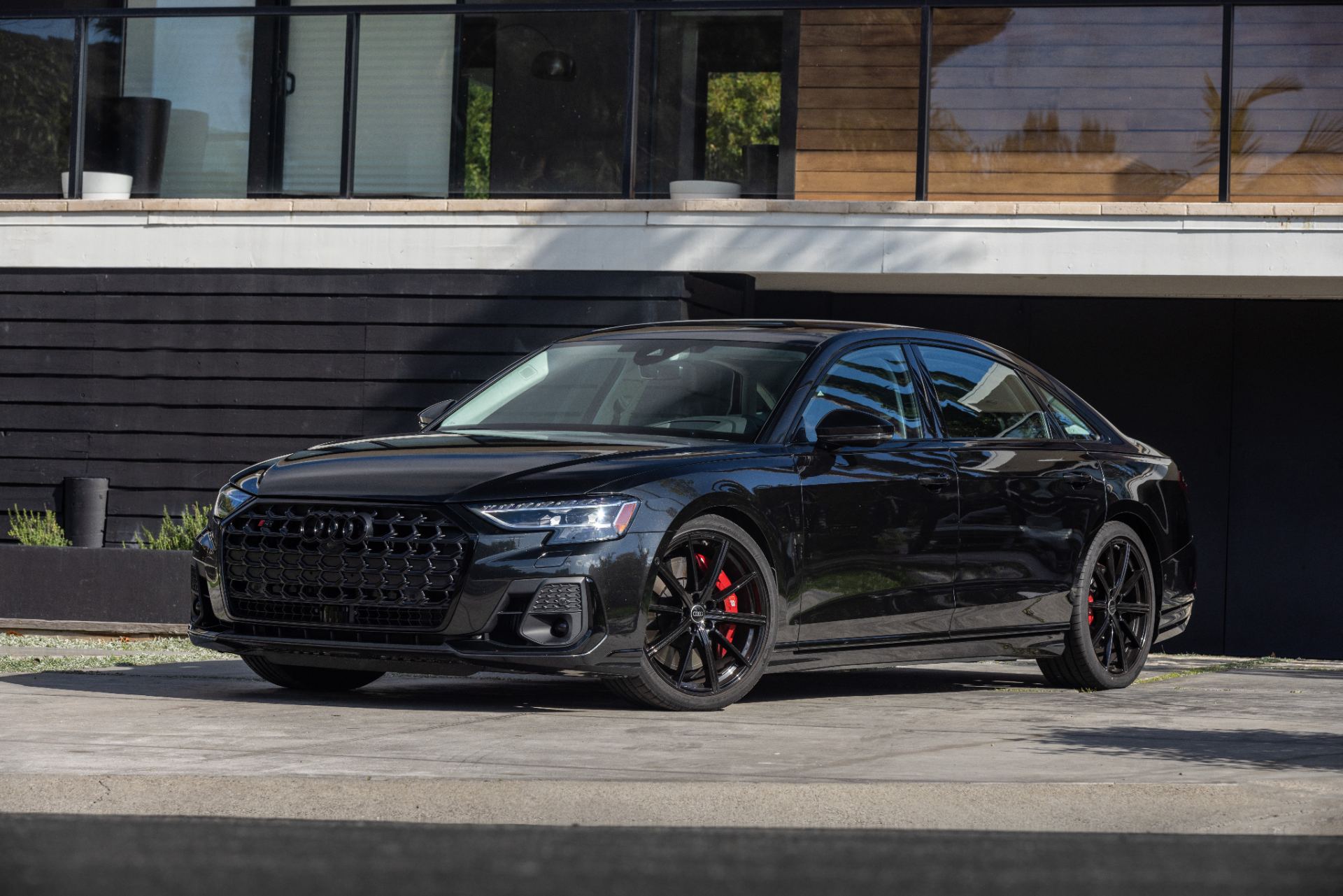 2026 audi s8 front three quarter modern house black