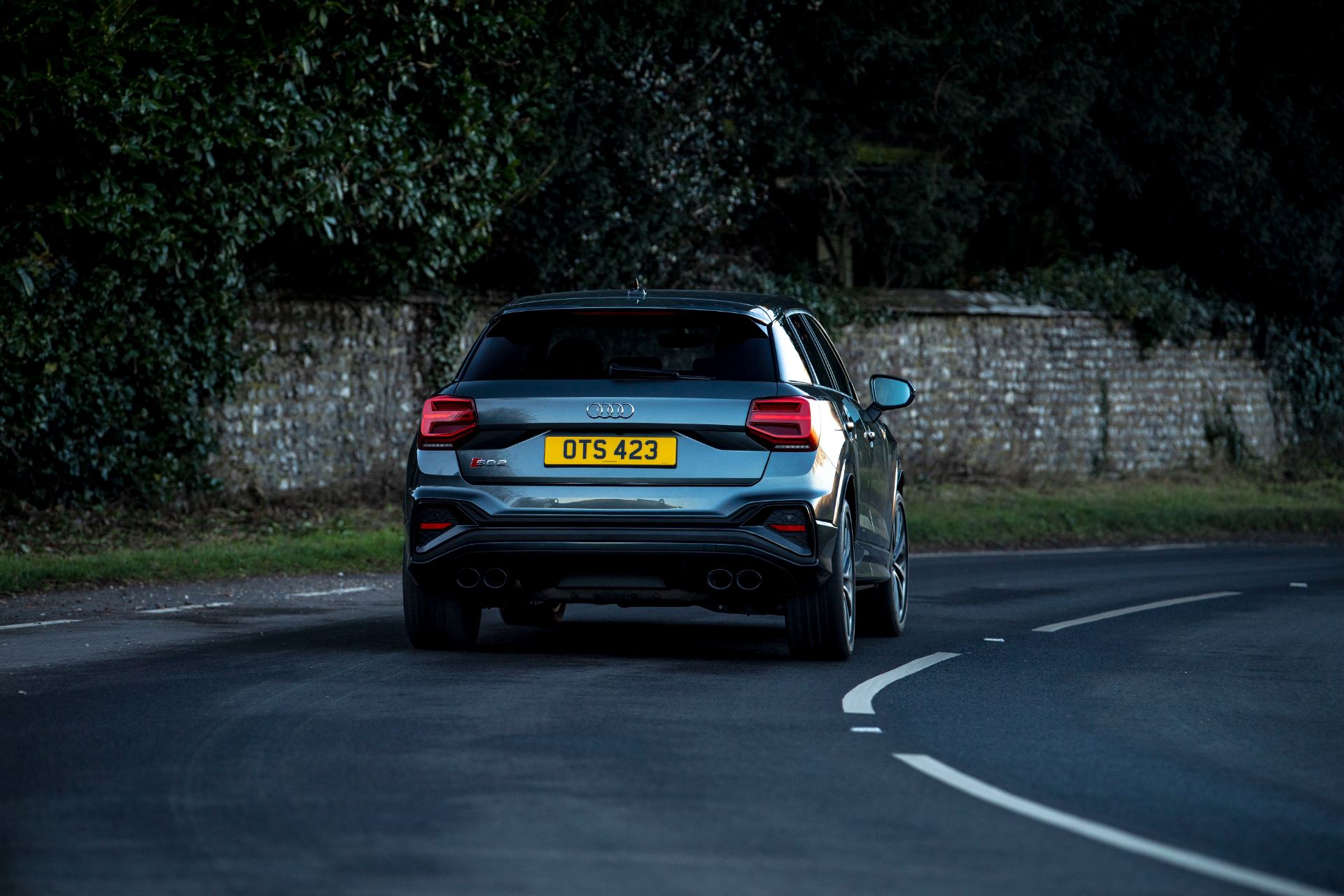 2025 audi sq2 driving rear stone wall grey
