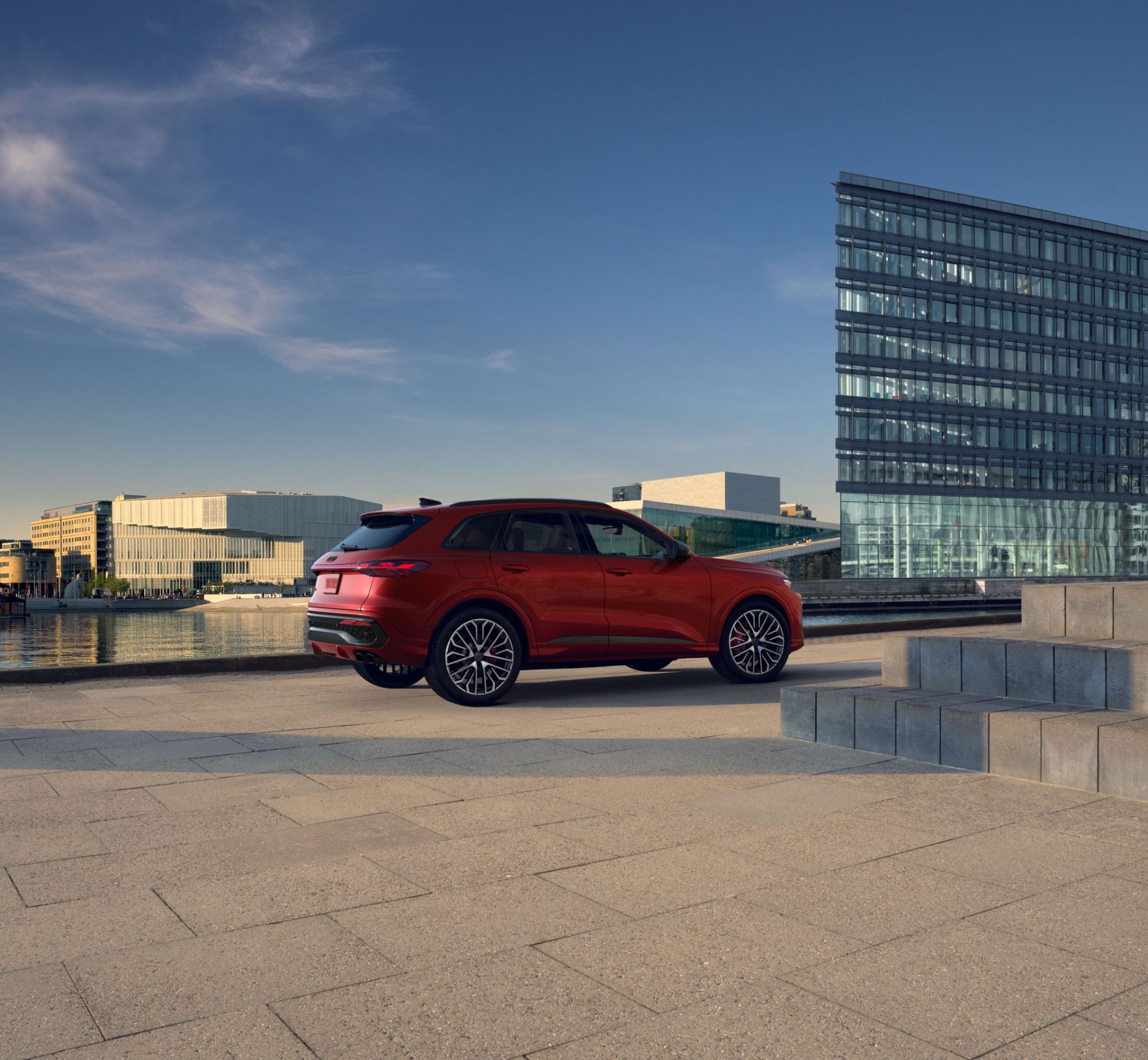 2026 audi sq5 rear three quarter waterfront red