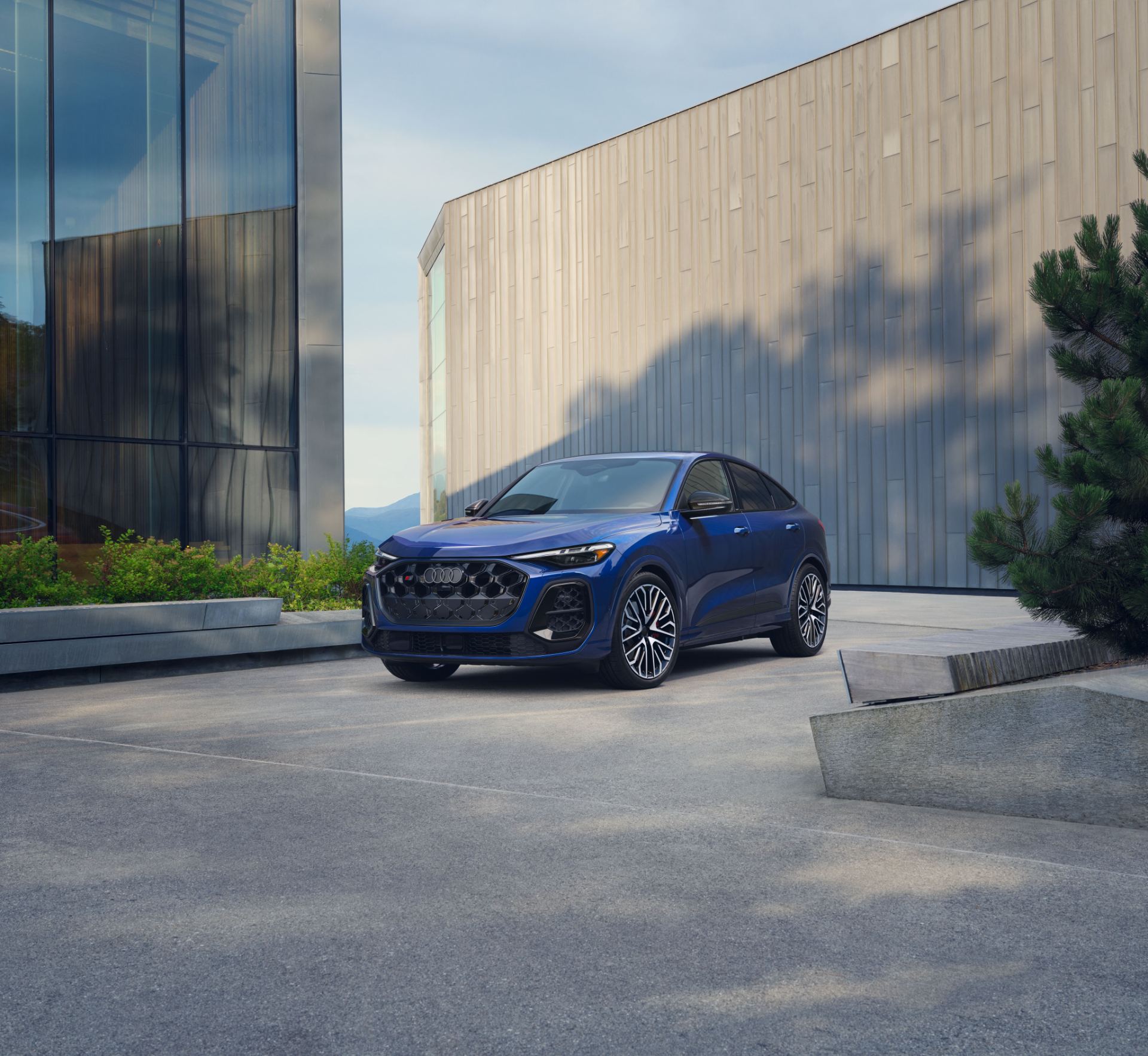 2026 audi sq5 sportback front three quarter modern building blue