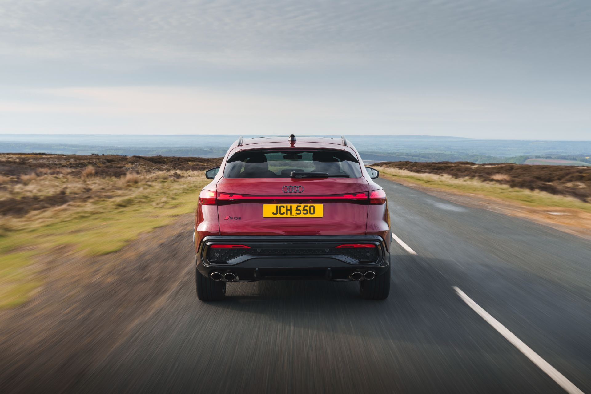 2026 audi sq5 sportback driving rear red