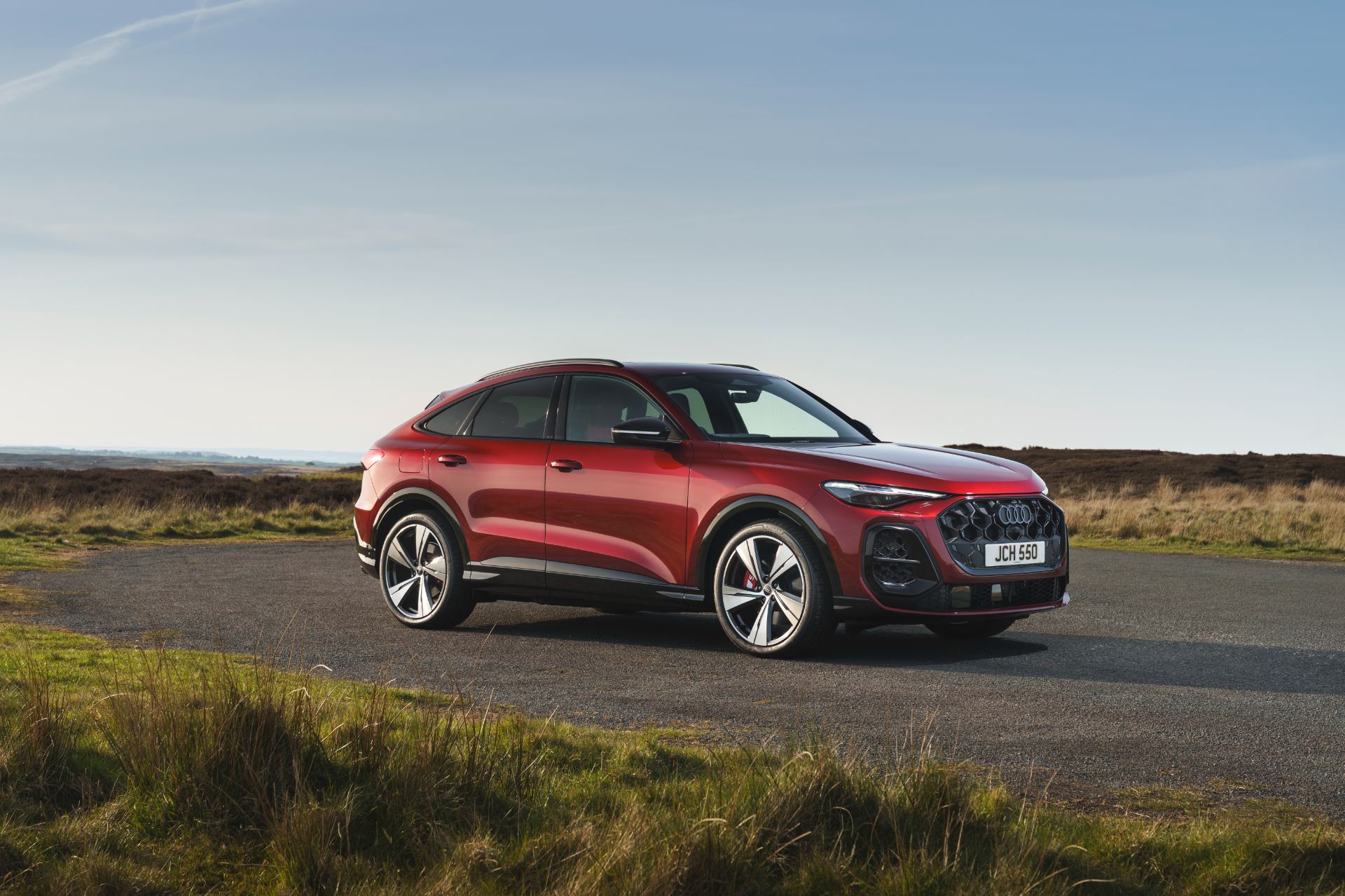 2026 audi sq5 sportback front three quarter heathland red