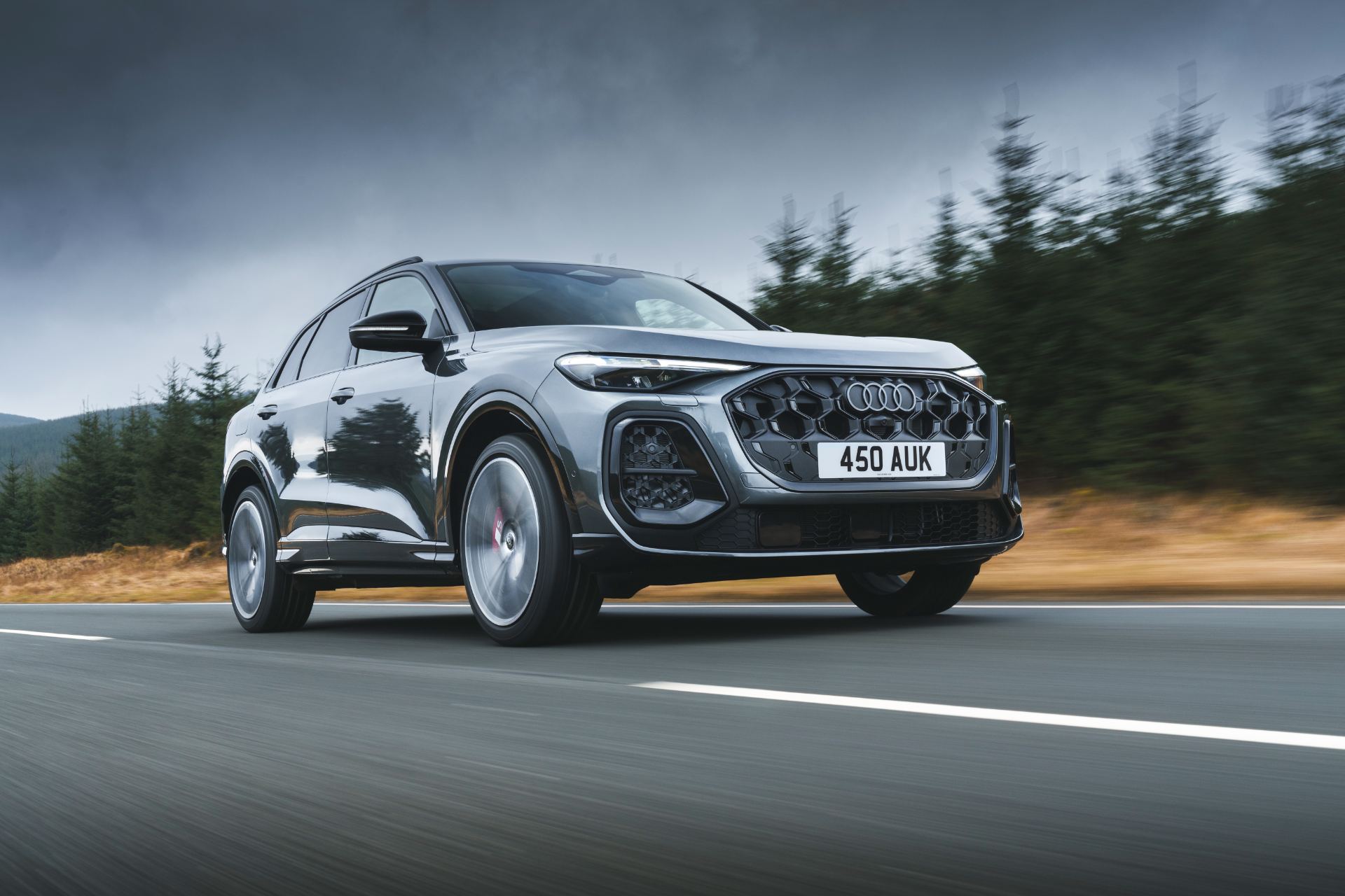 2026 audi sq5 driving front three quarter grey