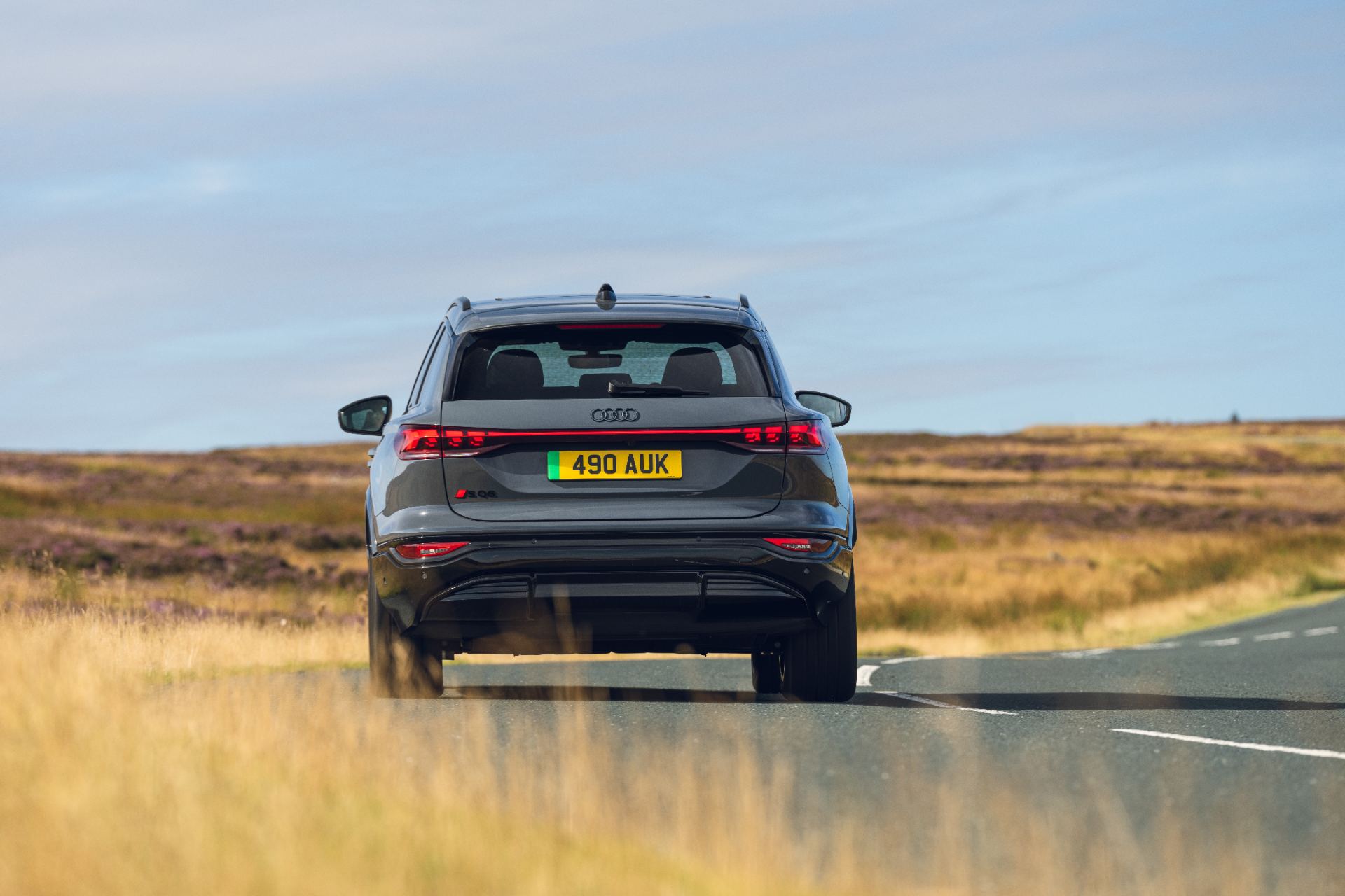 2026 audi sq6 e tron driving rear grey