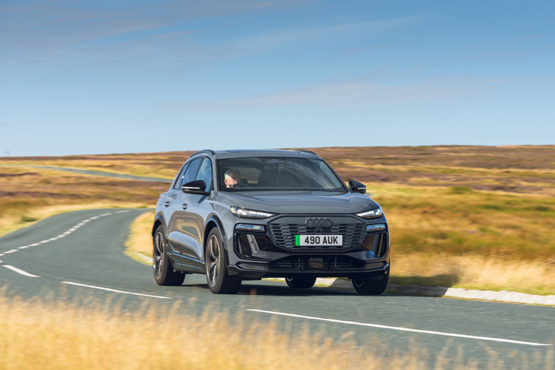 2026 audi sq6 e tron driving front three quarter grey