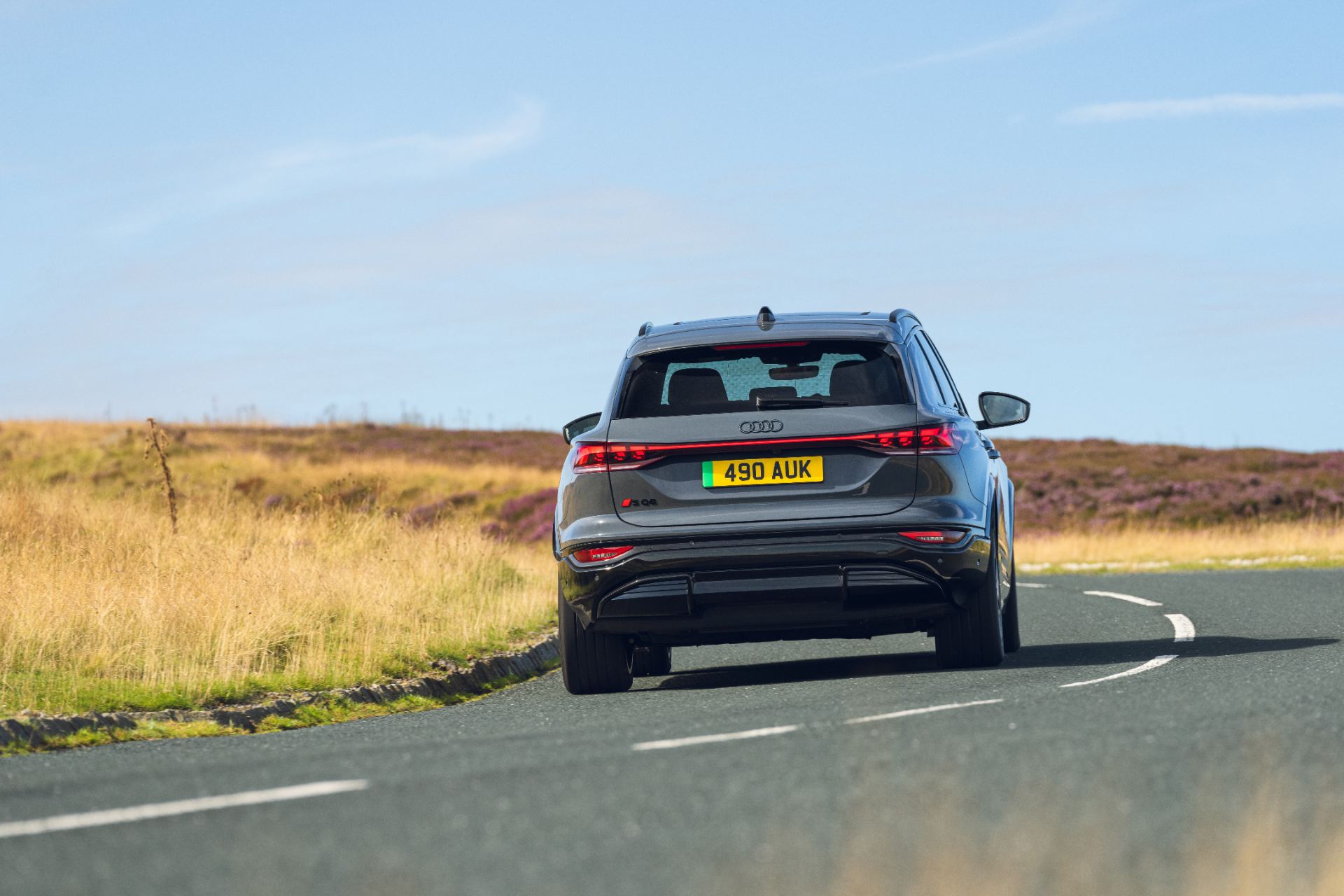 2026 audi sq6 e tron driving rear bend grey