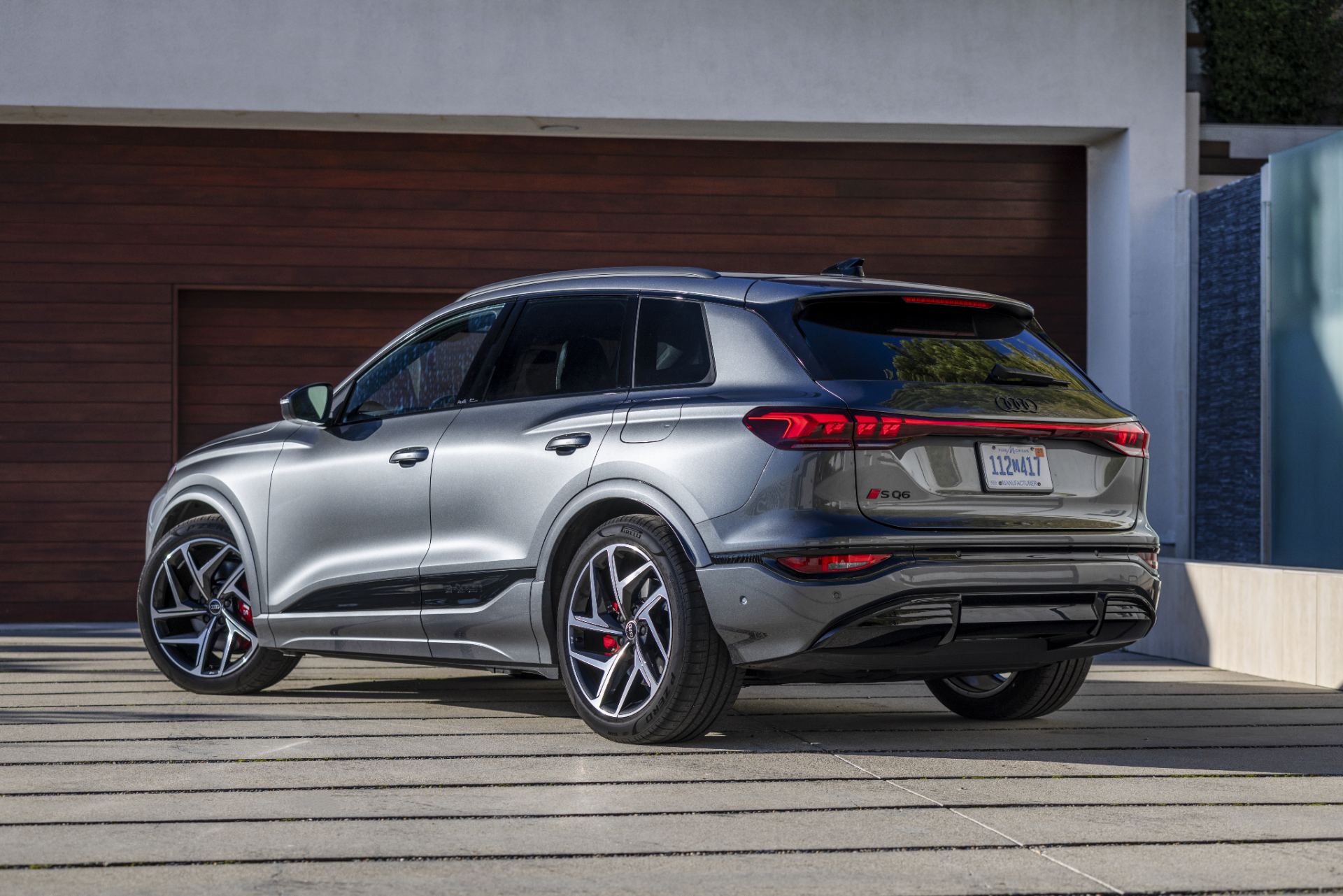 2027 audi sq6 e tron rear three quarter modern garage silver