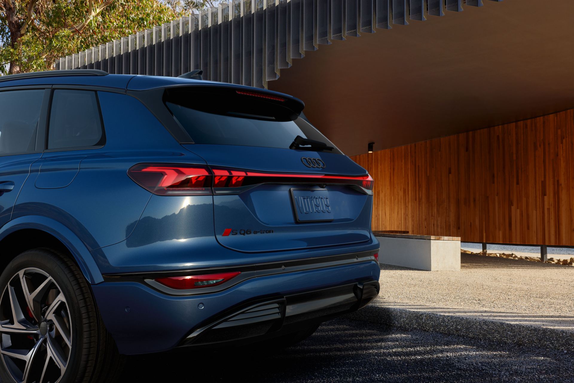 2027 audi sq6 e tron rear quarter carport detail blue