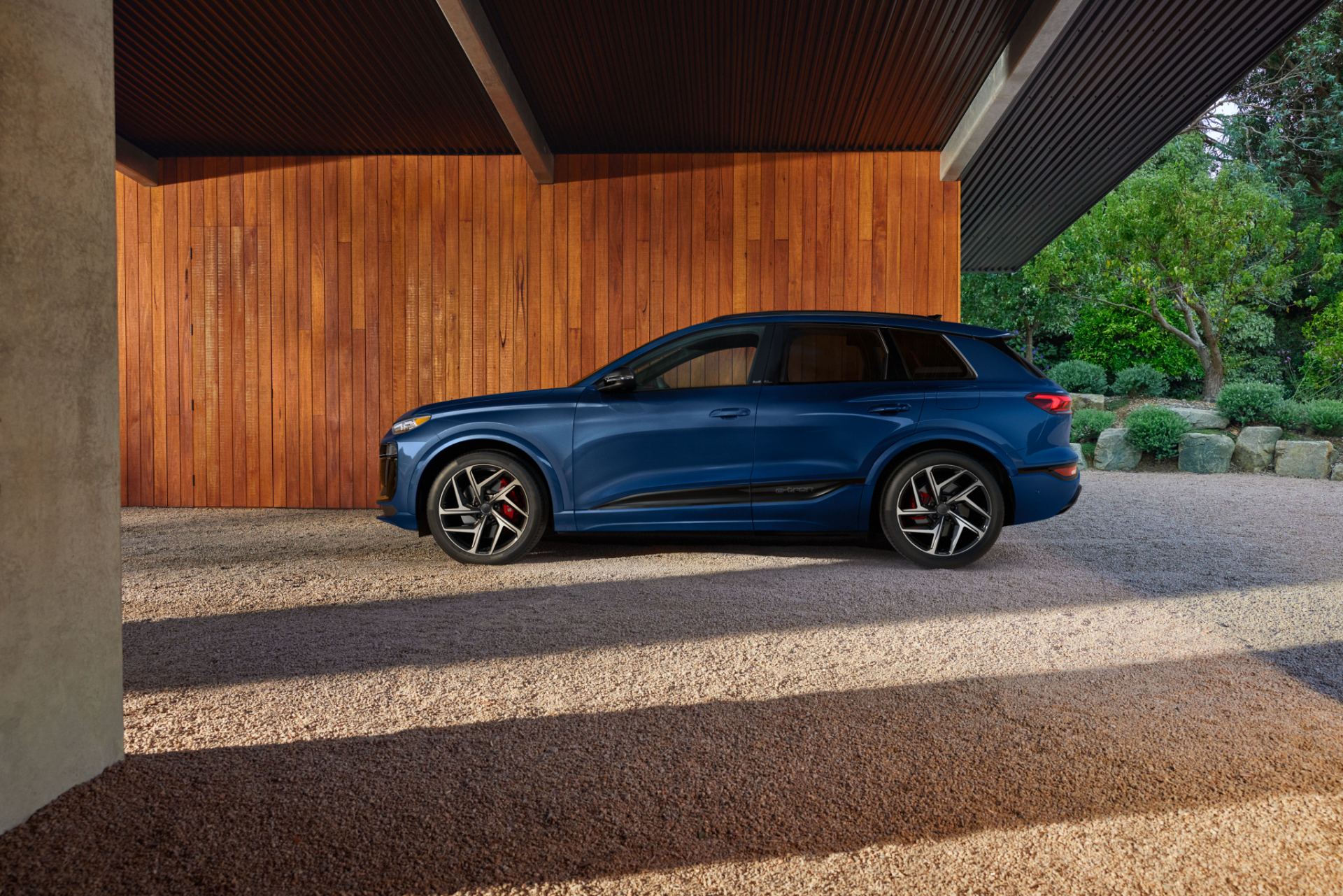 2027 audi sq6 e tron side profile carport blue