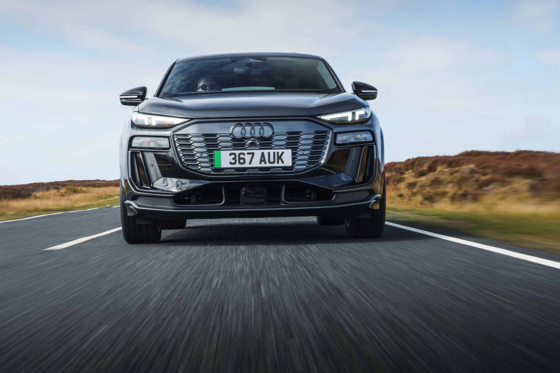 2026 audi sq6 sportback e tron driving front low angle grey