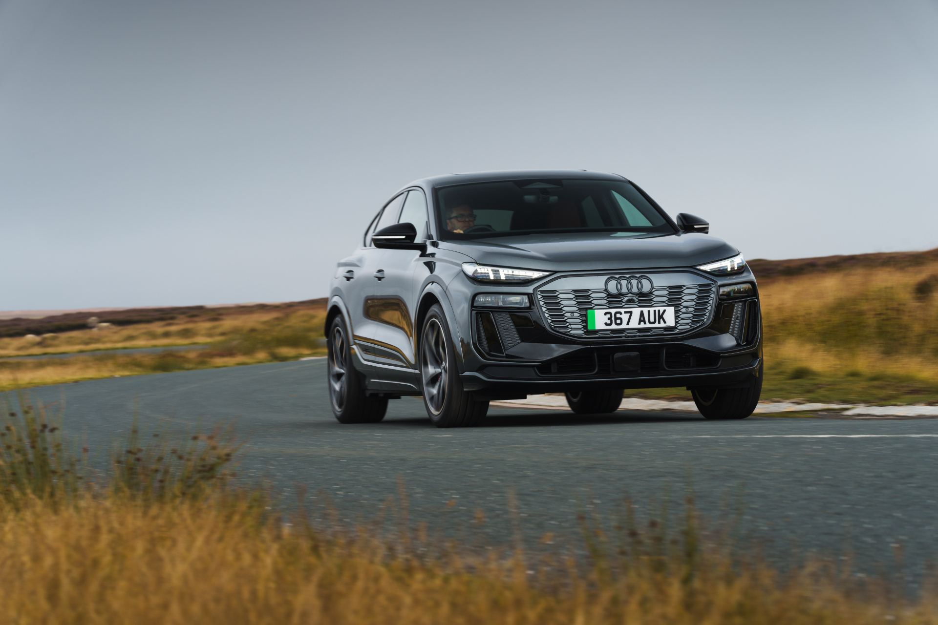 2026 audi sq6 sportback e tron driving front three quarter grey