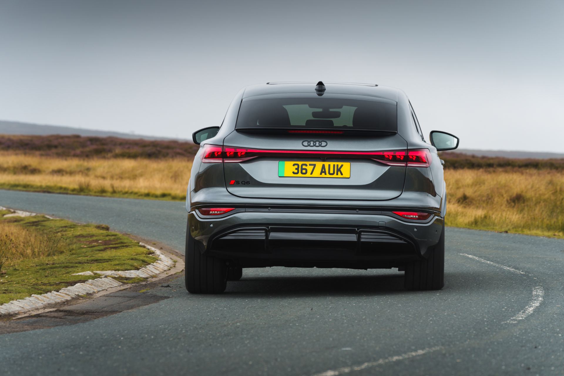 2026 audi sq6 sportback e tron driving rear grey