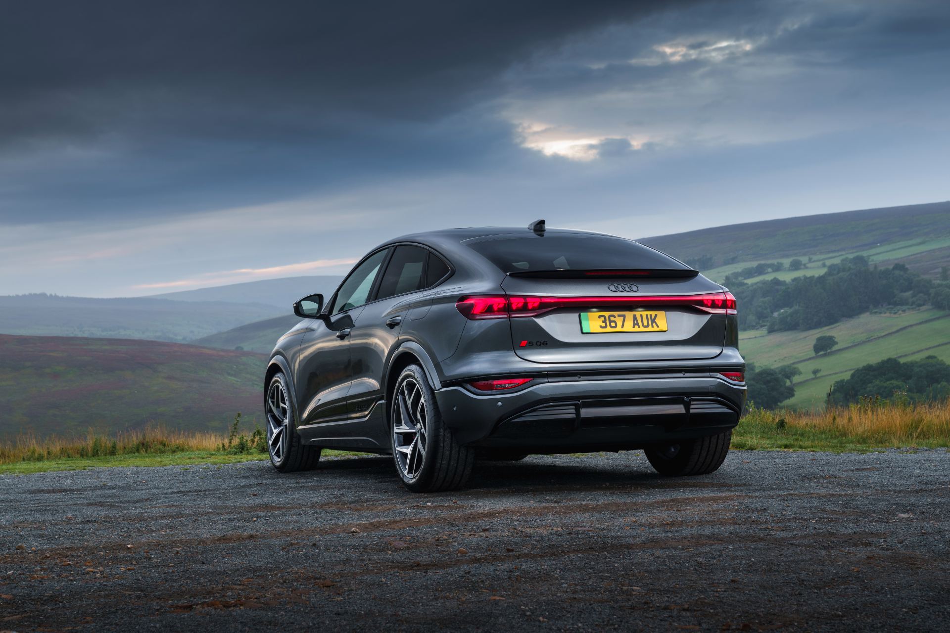 2026 audi sq6 sportback e tron rear three quarter grey