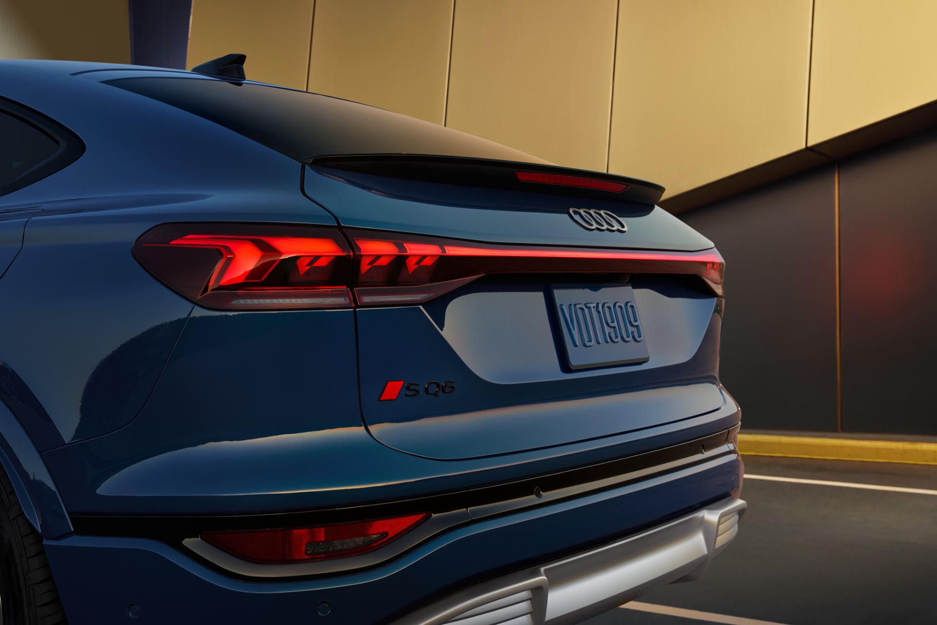 2027 audi sq6 sportback e tron rear detail sq6 badge blue