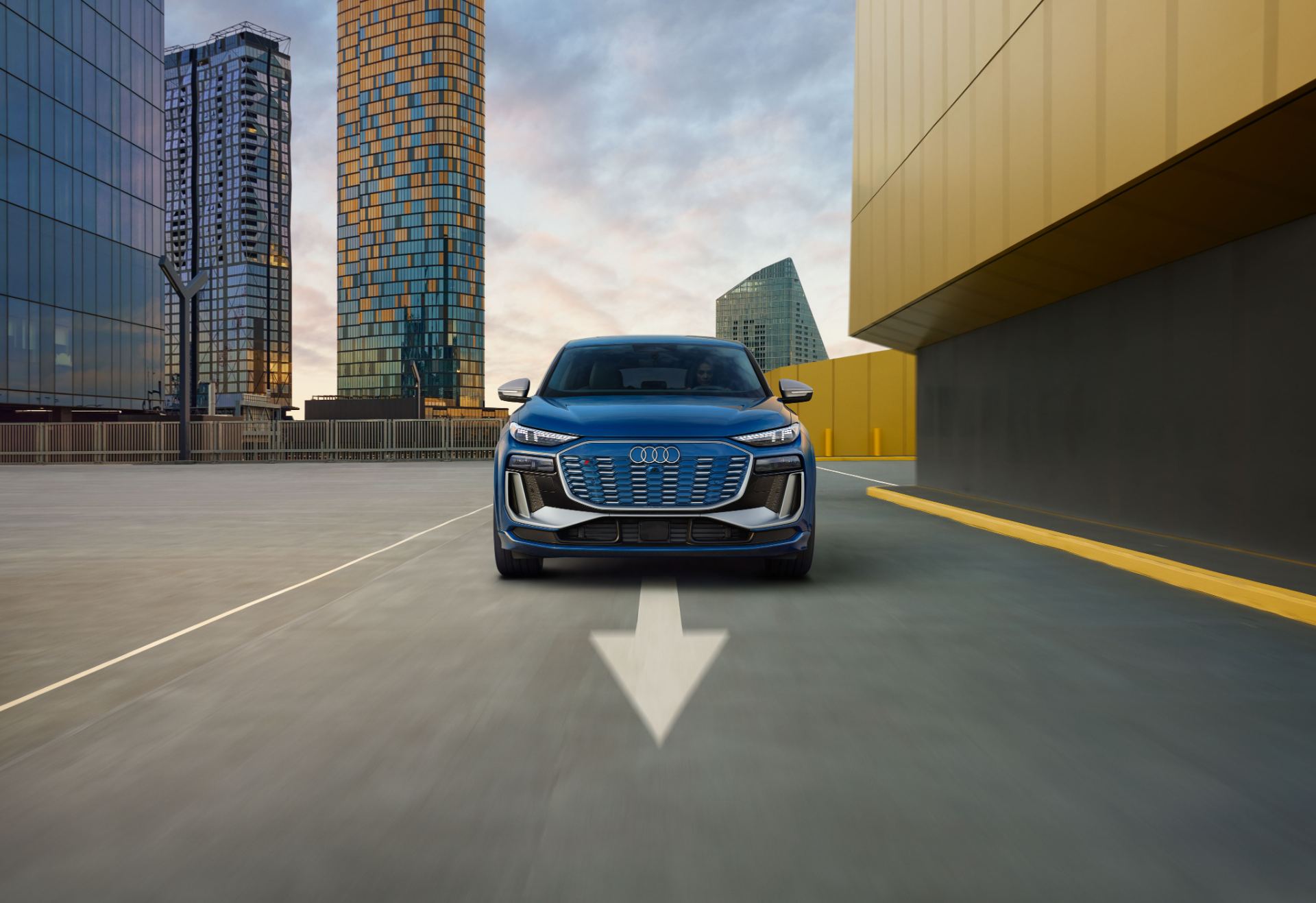 2027 audi sq6 sportback e tron driving front city towers blue