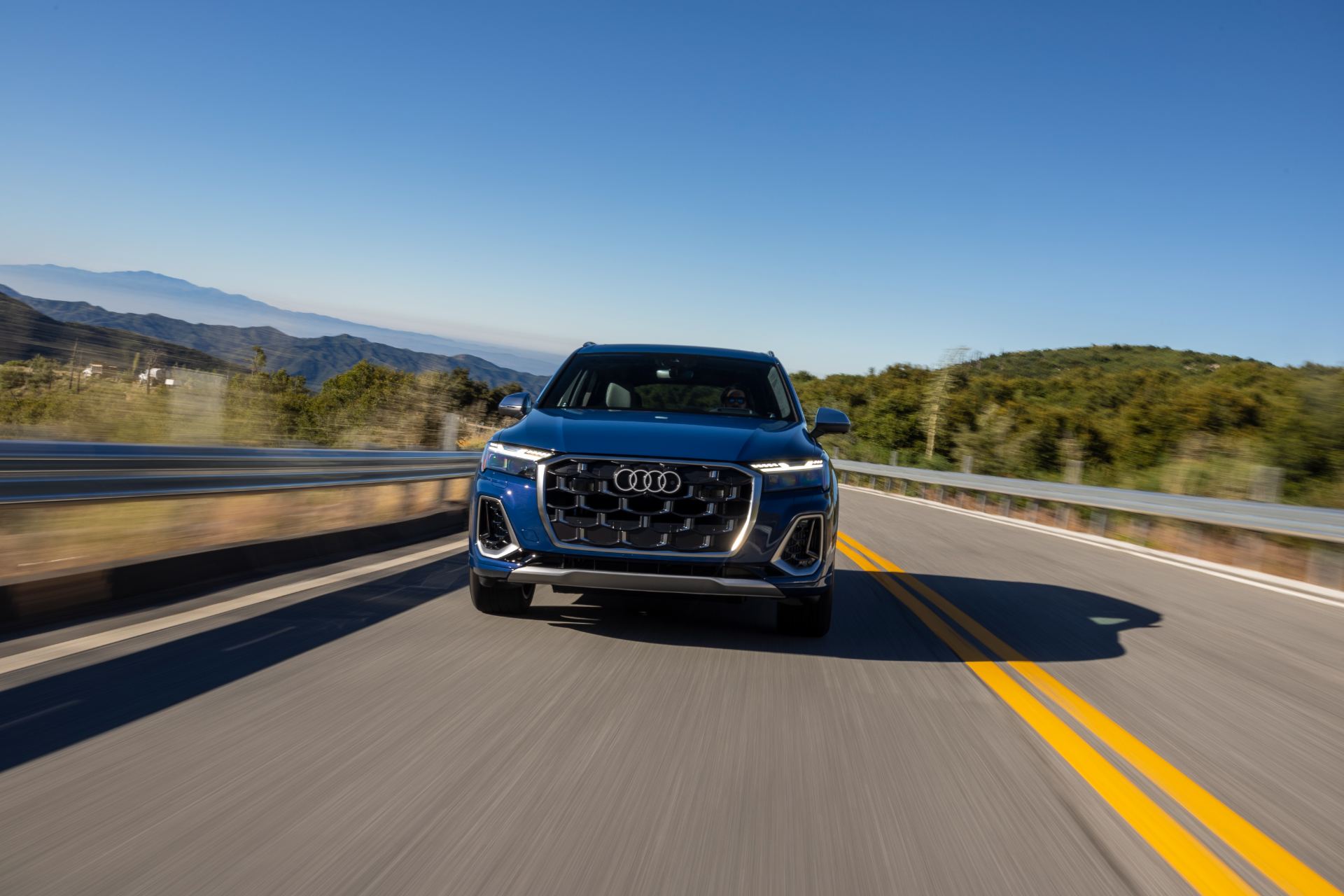 audi sq7 driving front highway blue