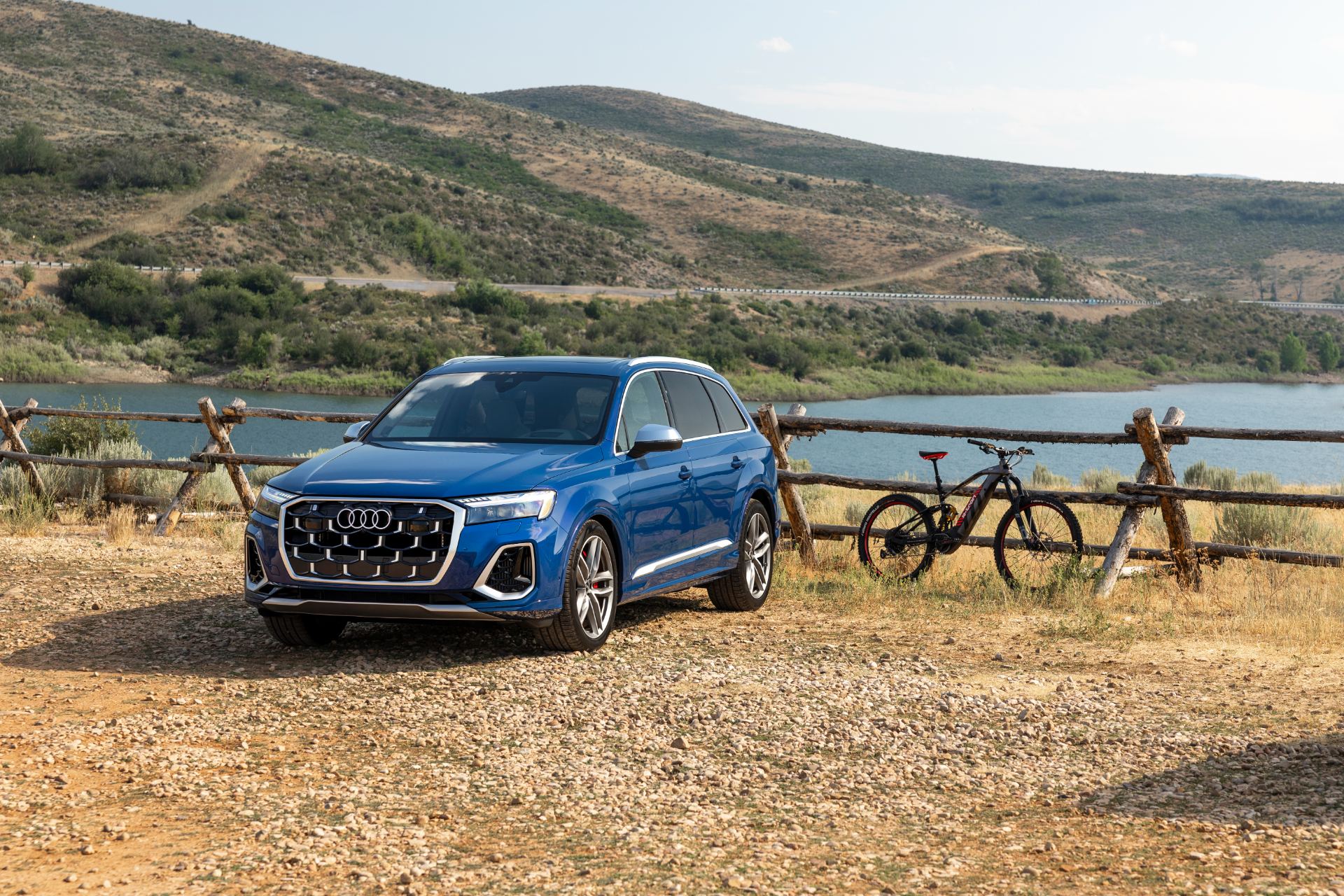 audi sq7 front three quarter lake bike blue