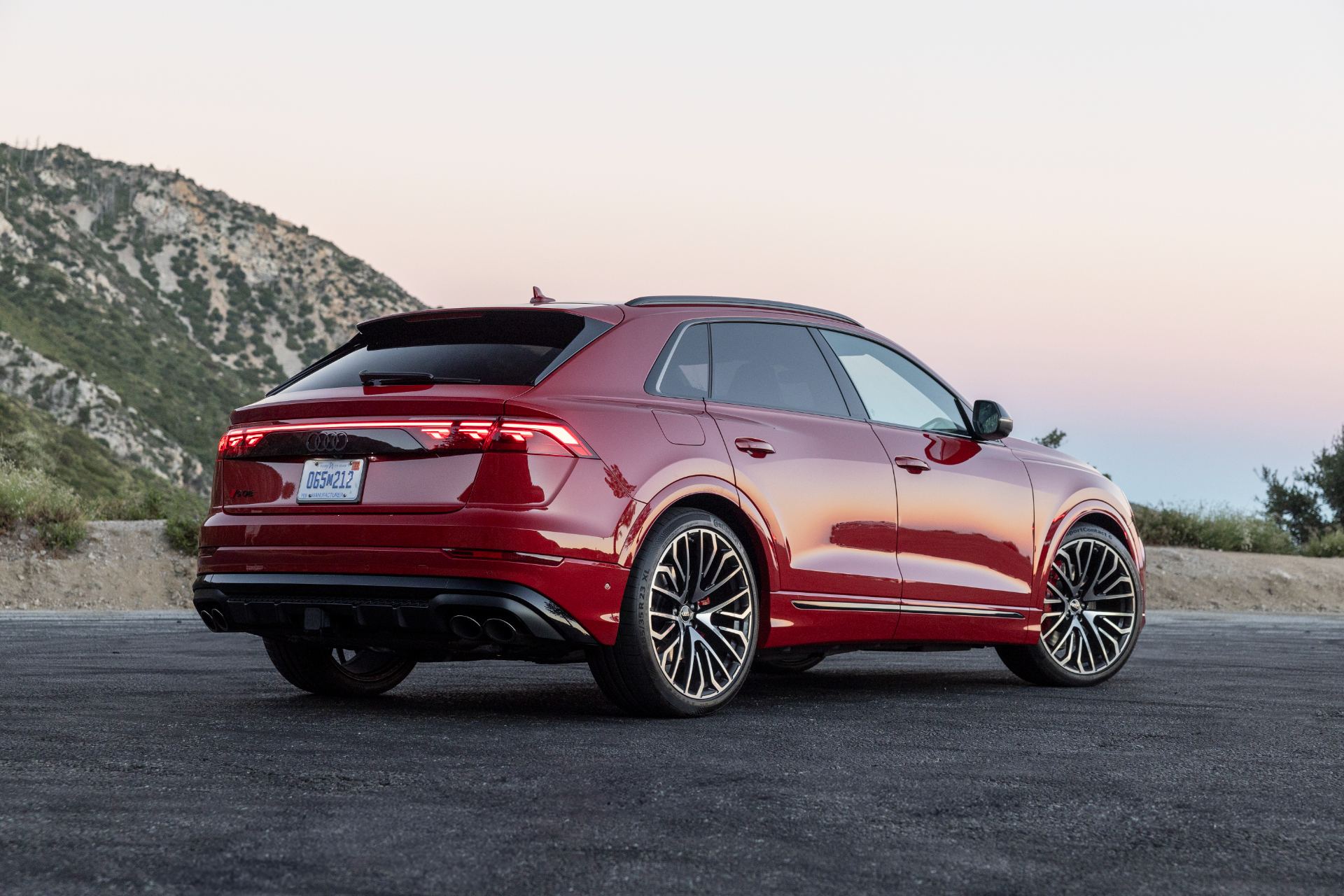 audi sq8 rear three quarter dusk red