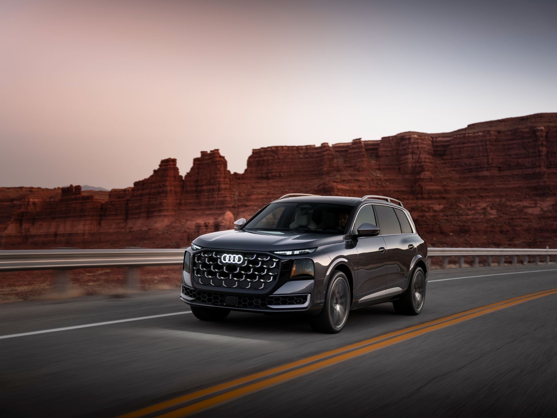 2027 audi sq9 driving front three quarter canyon grey